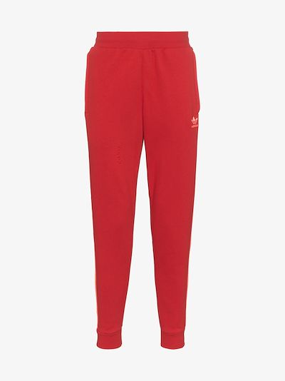 red stripe adidas pants