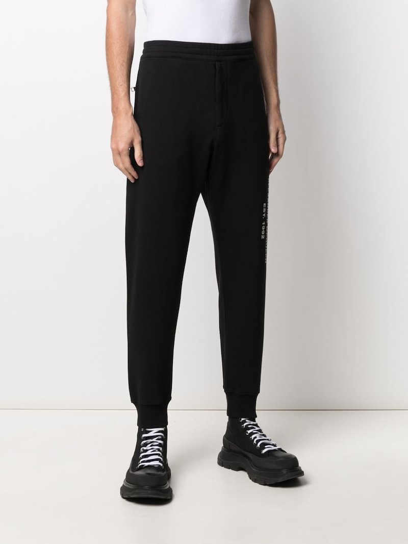 Alexander Mcqueen Logo Graffiti Print Track Pants Black Modes