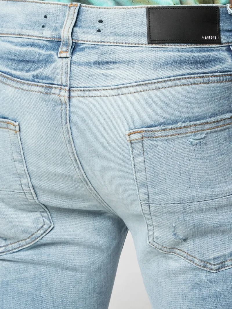 amiri distressed skinny jeans