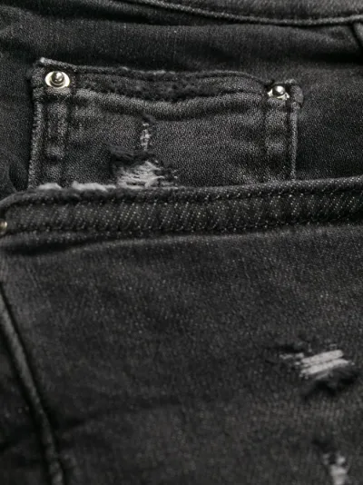 amiri distressed skinny jeans