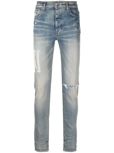 Amiri distressed best sale skinny jeans