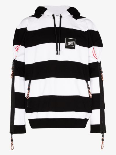 white hoodie with black stripes on sleeves