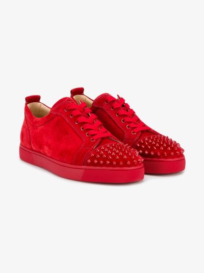 red sneakers with spikes