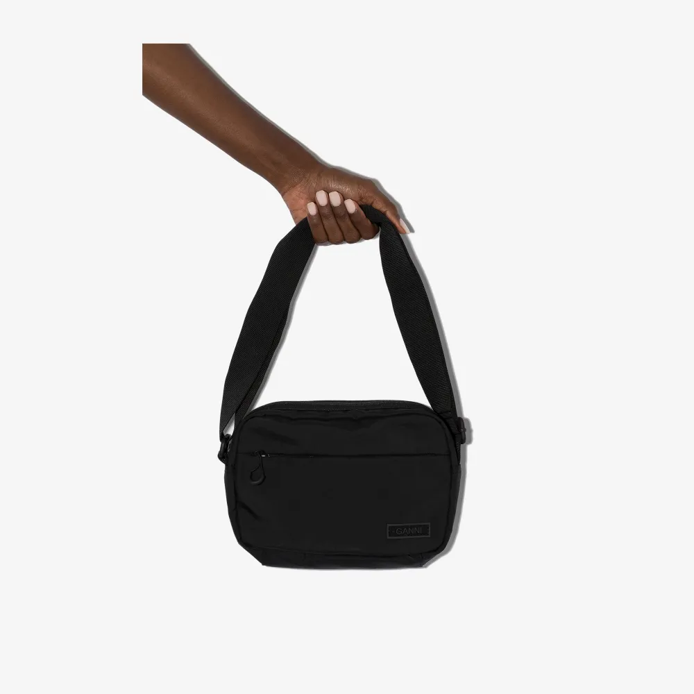 GANNI black cross body bag | Browns