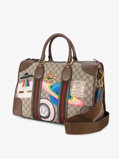 gucci supreme duffle bag