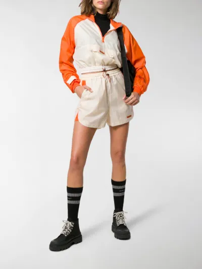 orange cropped windbreaker