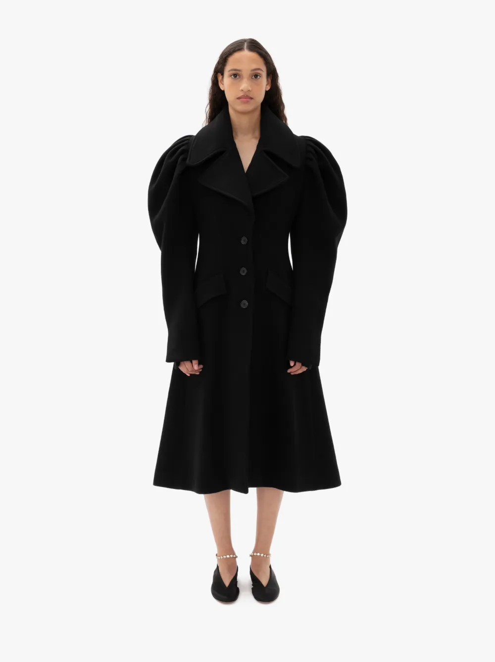 black pleated coat