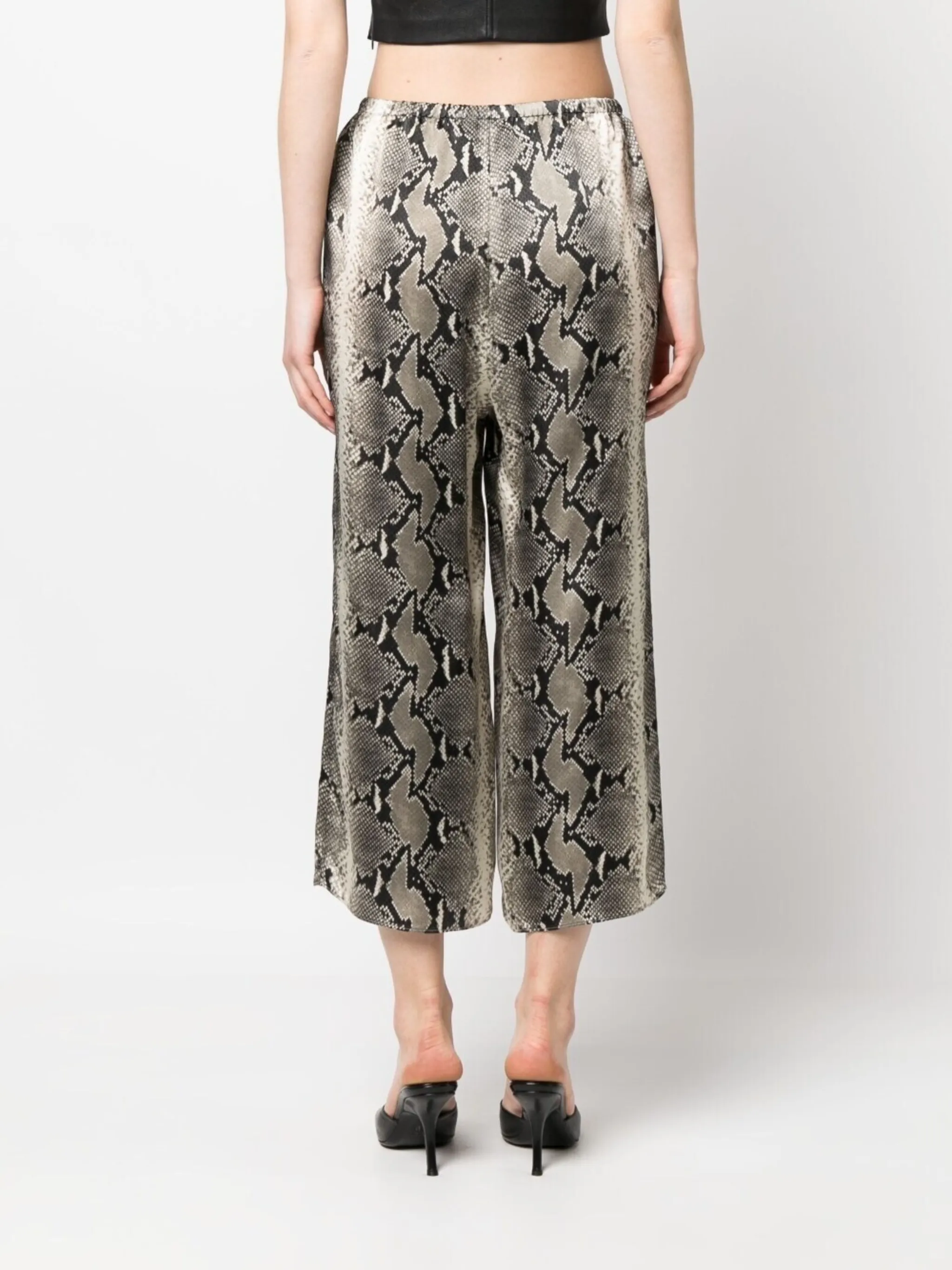 KHAITE Mindy snake-print crop trousers | Eraldo.com US