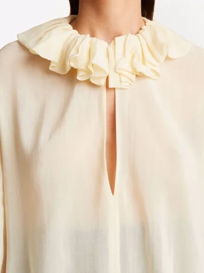 KHAITE ruffled neck blouse neutrals | MODES