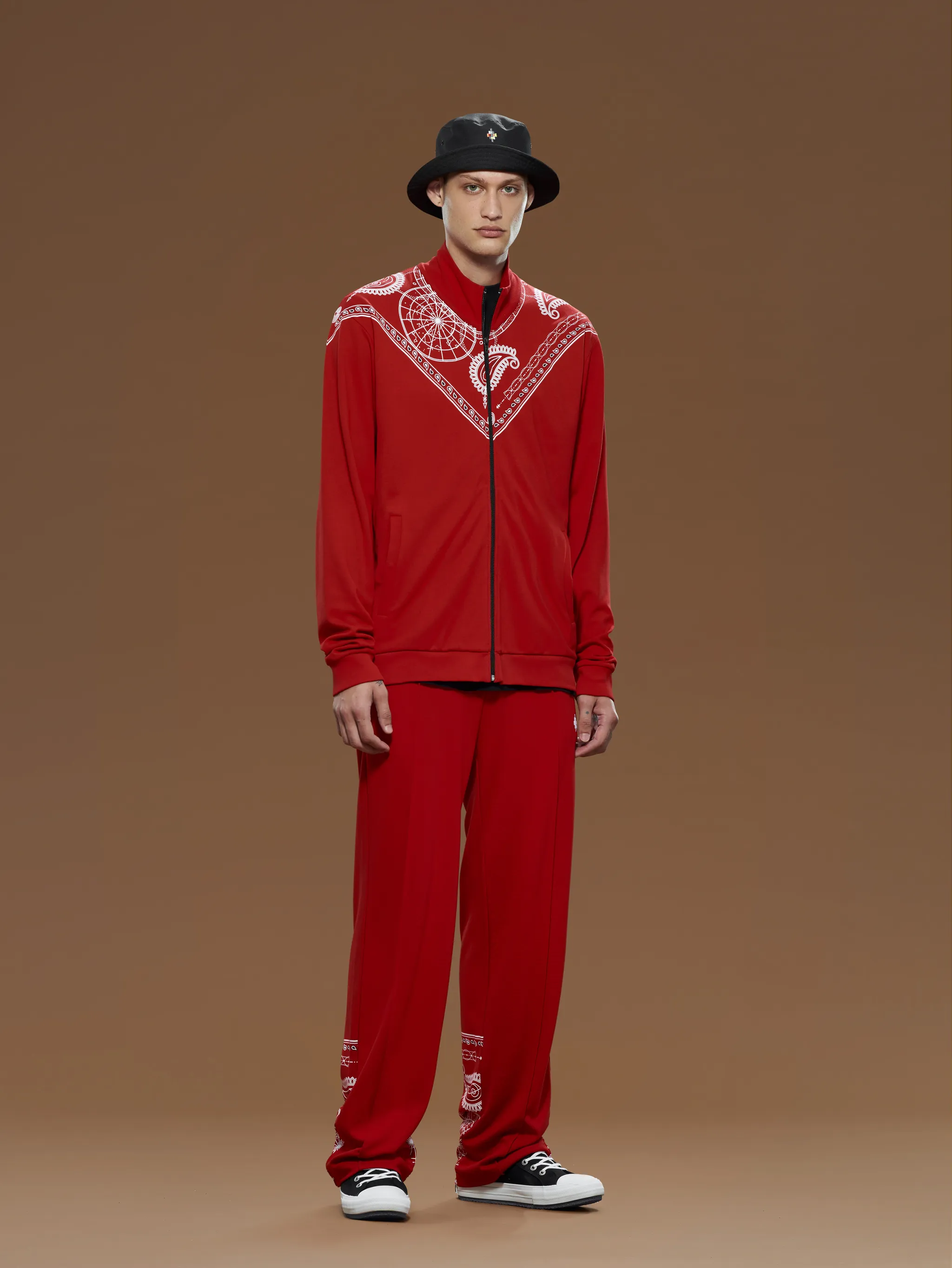 Red cotton Bandana-print track jacket from Marcelo Burlon County of Milan featuring funnel neck, front zip fastening, long sleeves, two side slit pockets and bandana print.