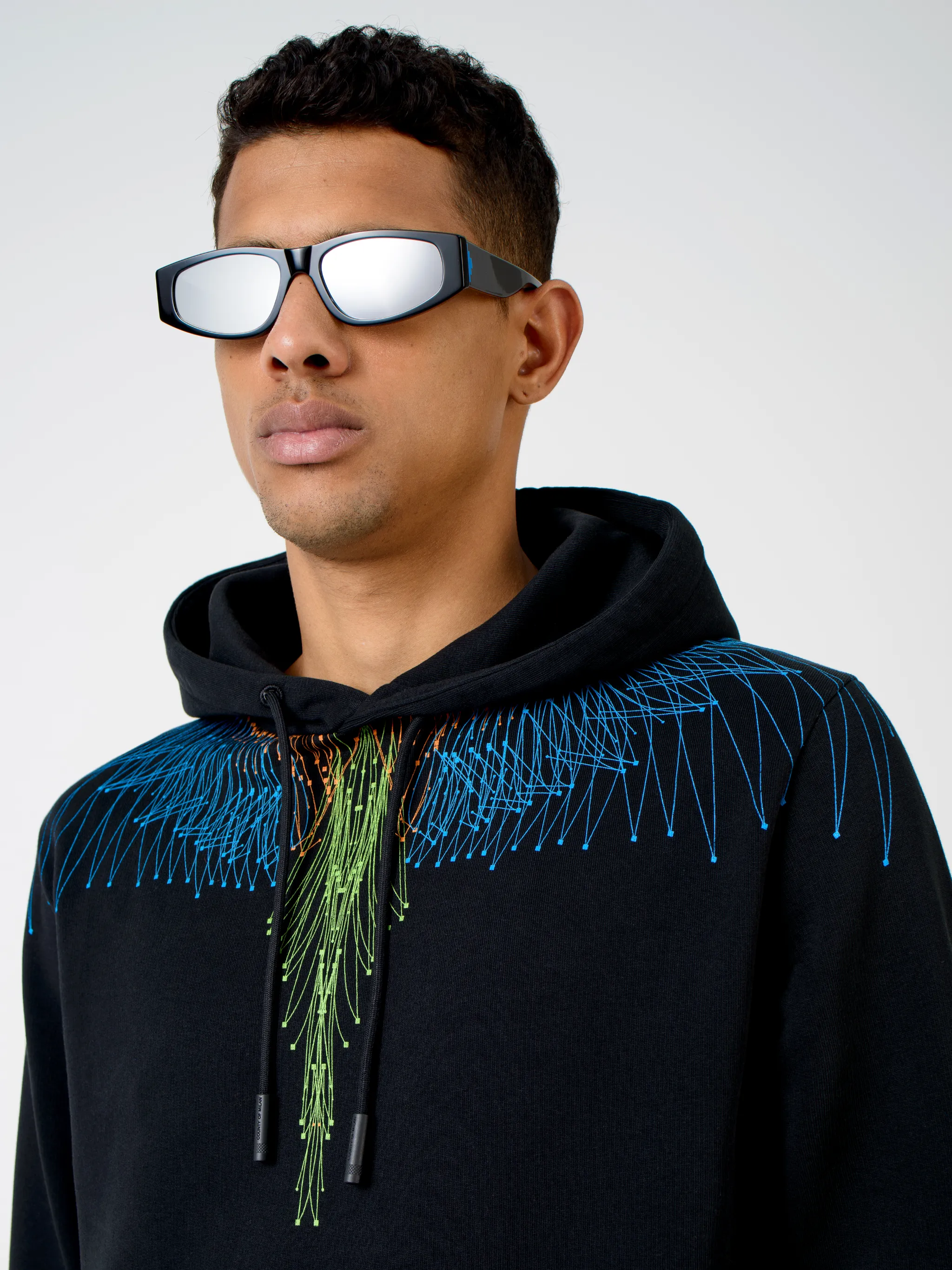 Black/blue/multicolour cotton graphic print hoodie from Marcelo Burlon County of Milan featuring classic hood, graphic print, feather print and long sleeves.