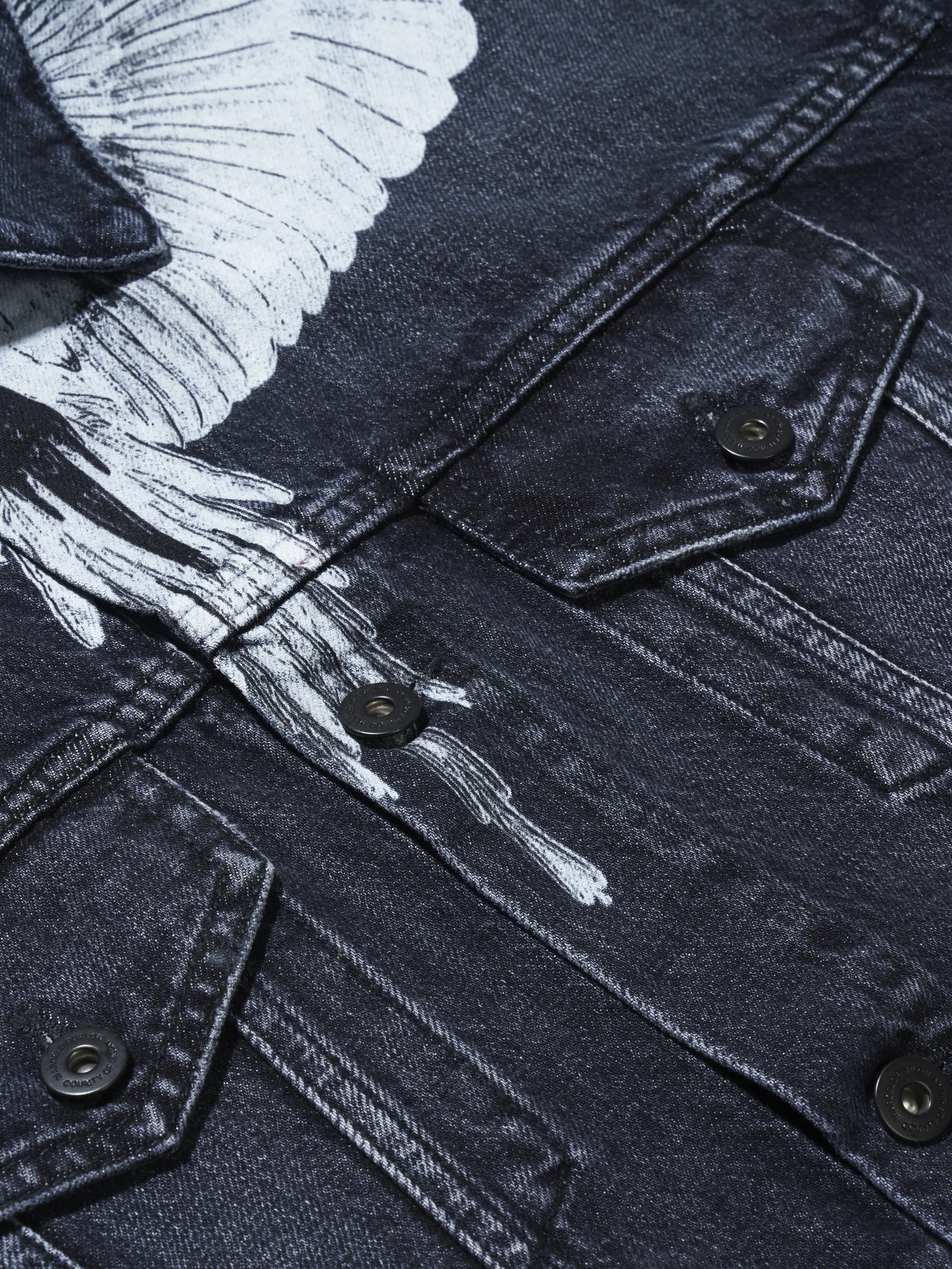 Black/white cotton-denim button-front denim jacket from Marcelo Burlon County of Milan featuring straight-point collar, front button fastening, long sleeves, wings print and front flap pockets.