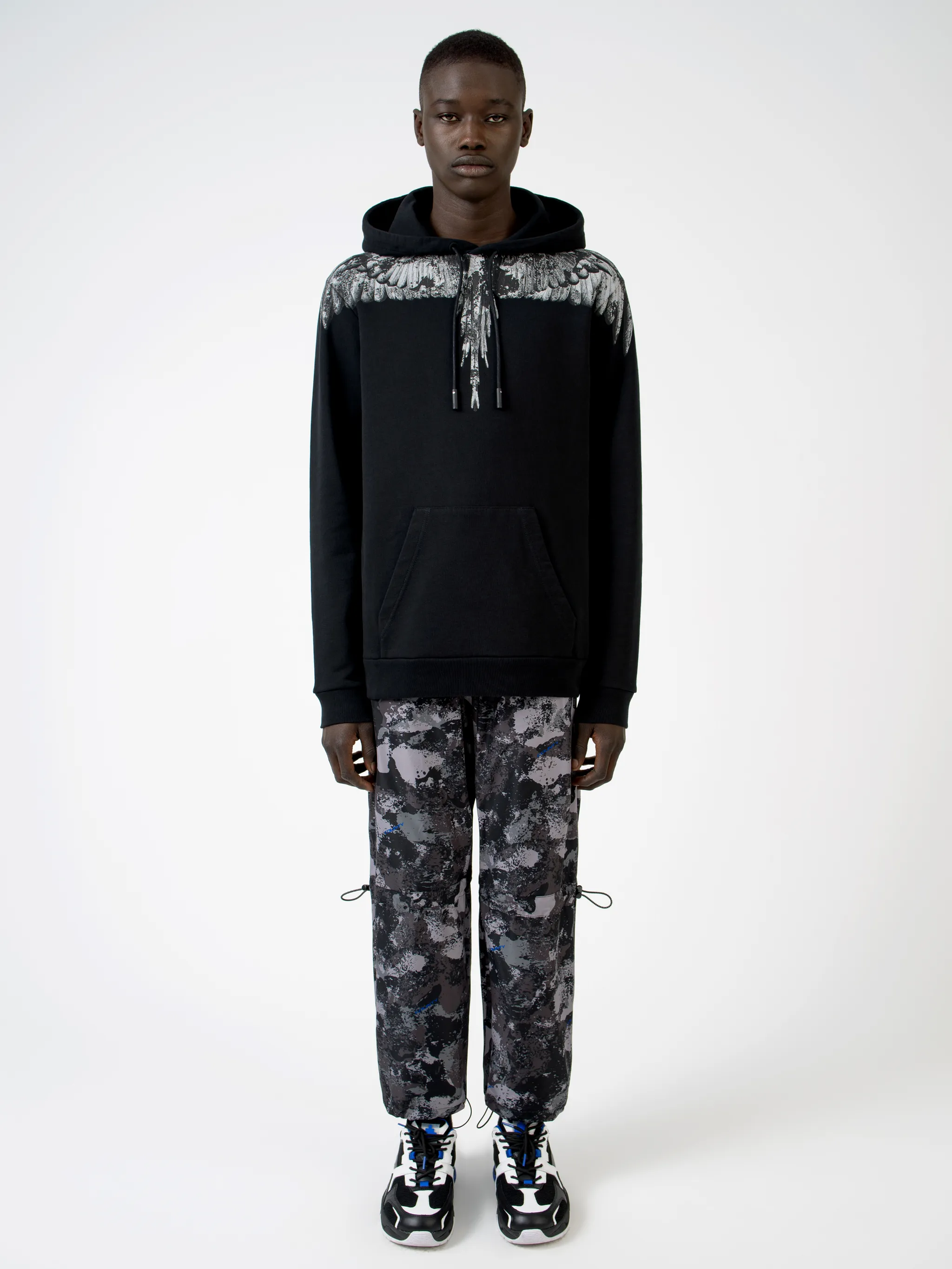 Black cotton wings-print hoodie from MARCELO BURLON COUNTY OF MILAN featuring drawstring hood, elasticated cuffs, elasticated hem and front pouch pocket.