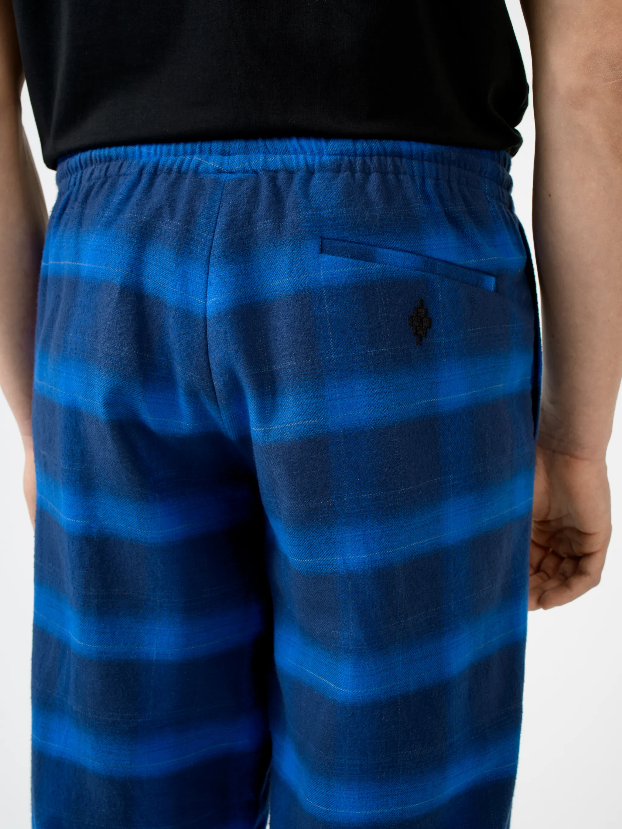 Blue/black cotton check-pattern tapered track pants from Marcelo Burlon County of Milan featuring check pattern, elasticated ankles, elasticated waistband, tapered design and two side slit pockets.