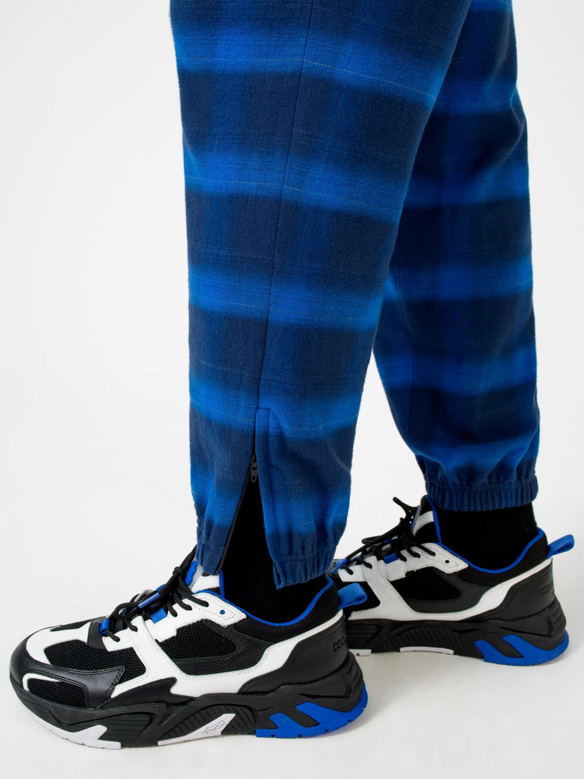 Blue/black cotton check-pattern tapered track pants from Marcelo Burlon County of Milan featuring check pattern, elasticated ankles, elasticated waistband, tapered design and two side slit pockets.