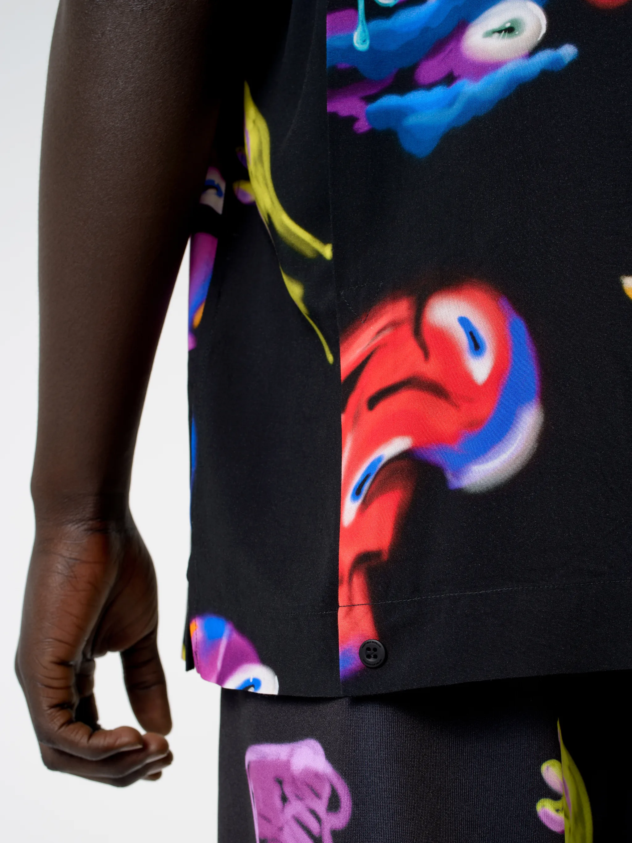 Black/multicolour Crazy Faces print shirt from Marcelo Burlon County of Milan featuring all-over logo print, spread collar, concealed front fastening, short sleeves and straight hem.