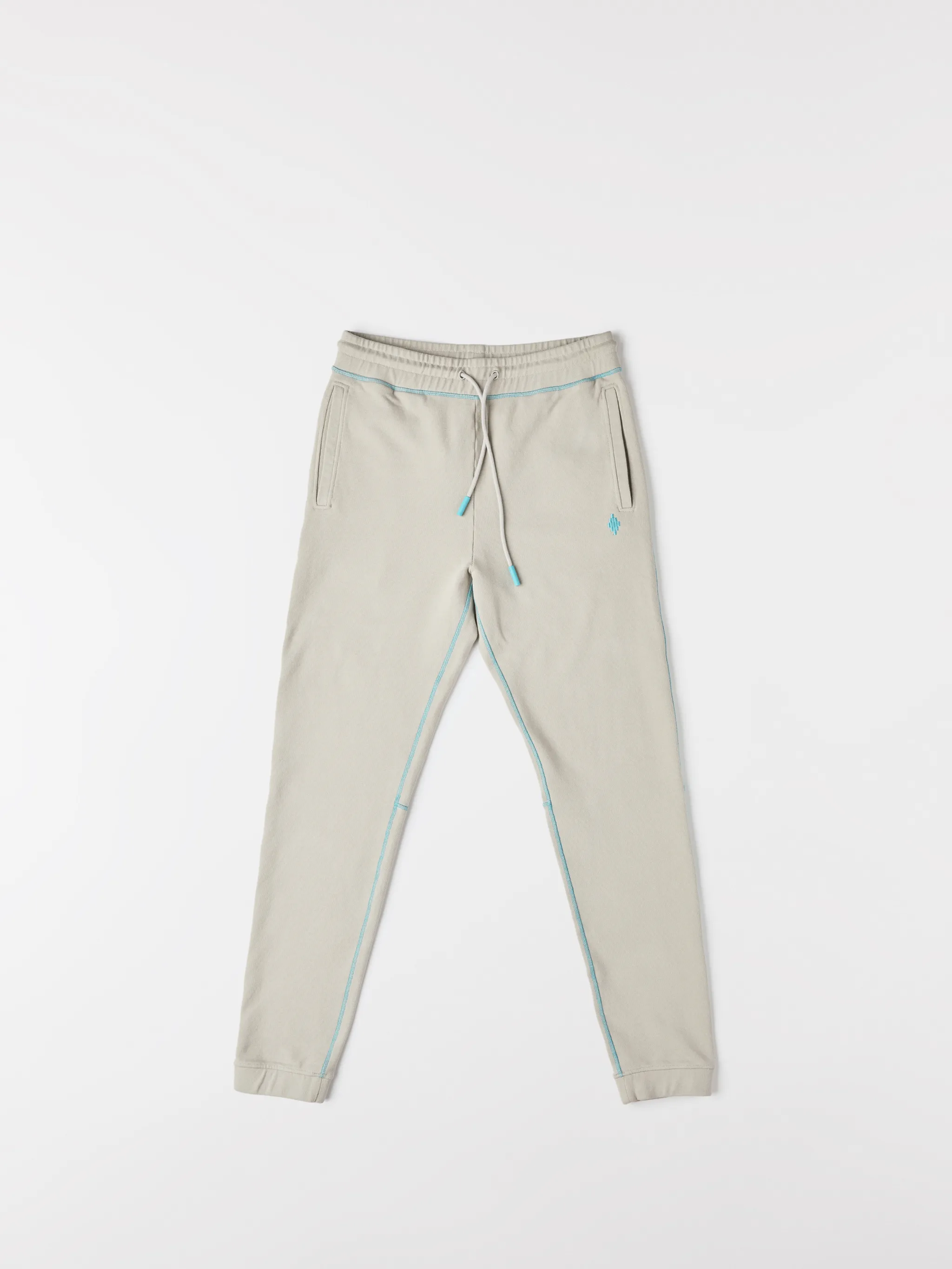 Beige cotton Cross tapered track pants from Marcelo Burlon County of Milan featuring embroidered logo to the rear, contrasting trim, elasticated ankles, elasticated waistband, drawstring fastening, tapered design, two side slit pockets and rear welt pocket.