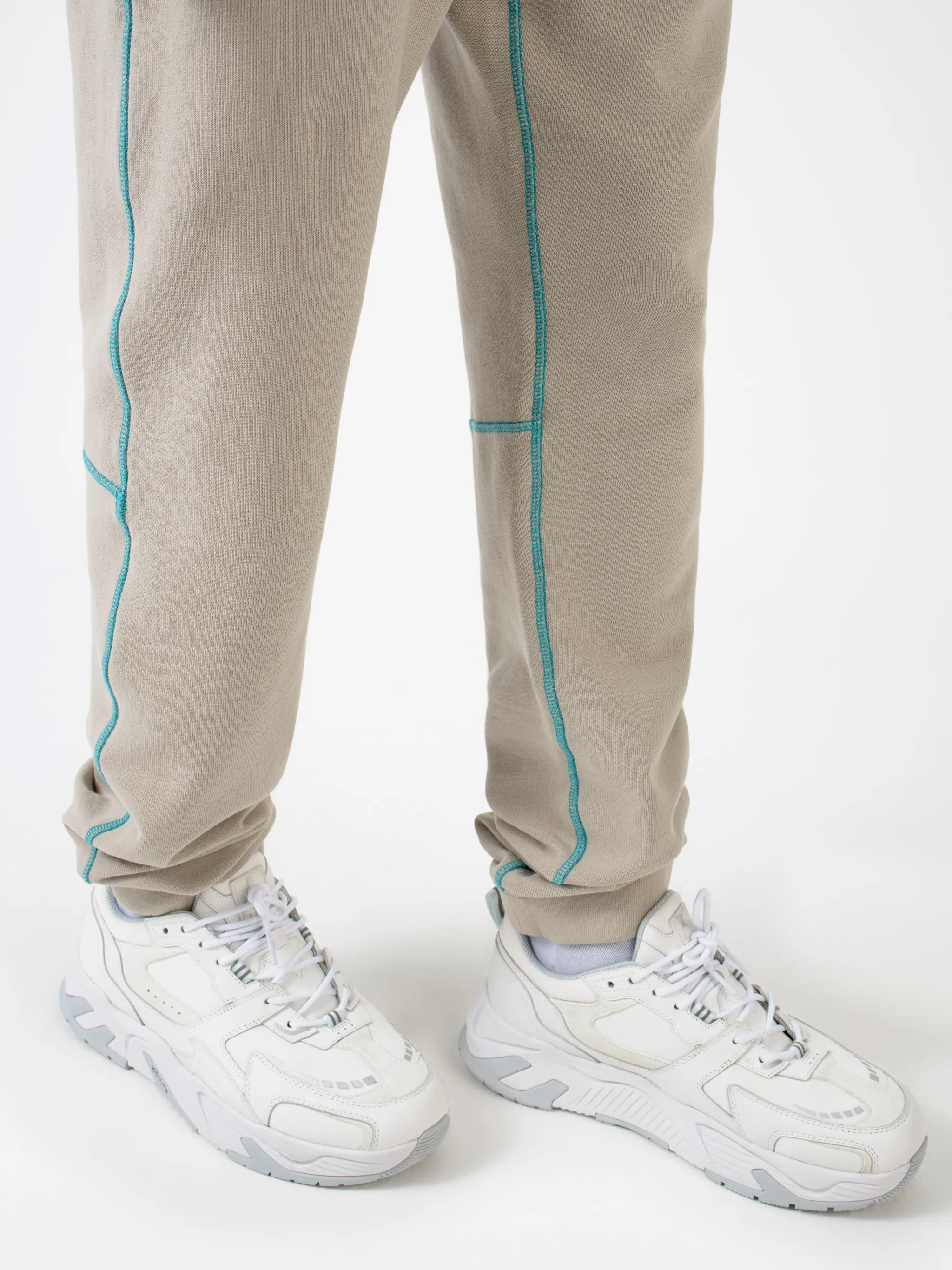 Beige cotton Cross tapered track pants from Marcelo Burlon County of Milan featuring embroidered logo to the rear, contrasting trim, elasticated ankles, elasticated waistband, drawstring fastening, tapered design, two side slit pockets and rear welt pocket.