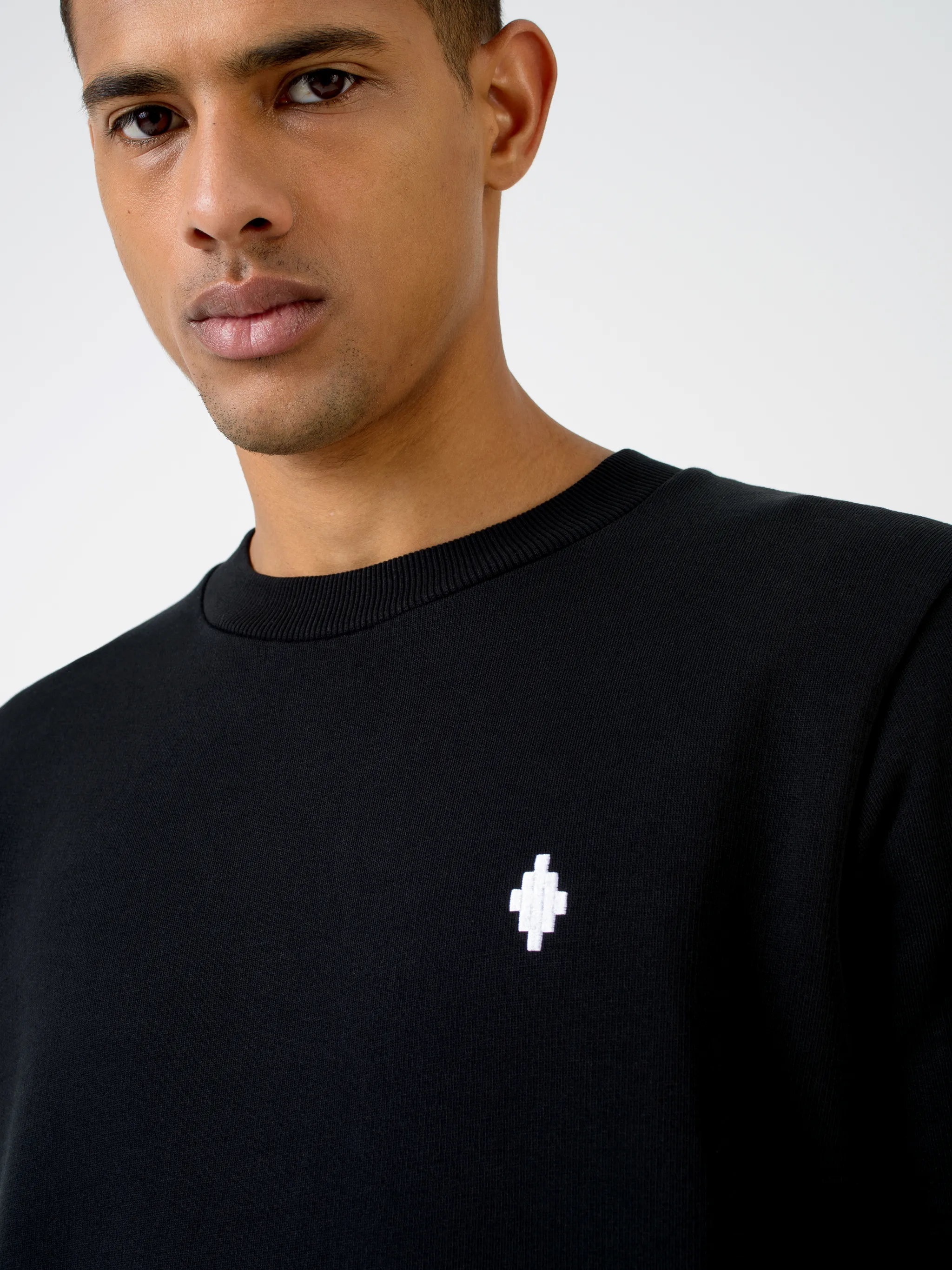 Black cotton Cross Tribe crew-neck sweatshirt from Marcelo Burlon County of Milan featuring embroidered logo at the chest, graphic print, crew neck, long sleeves and straight hem.