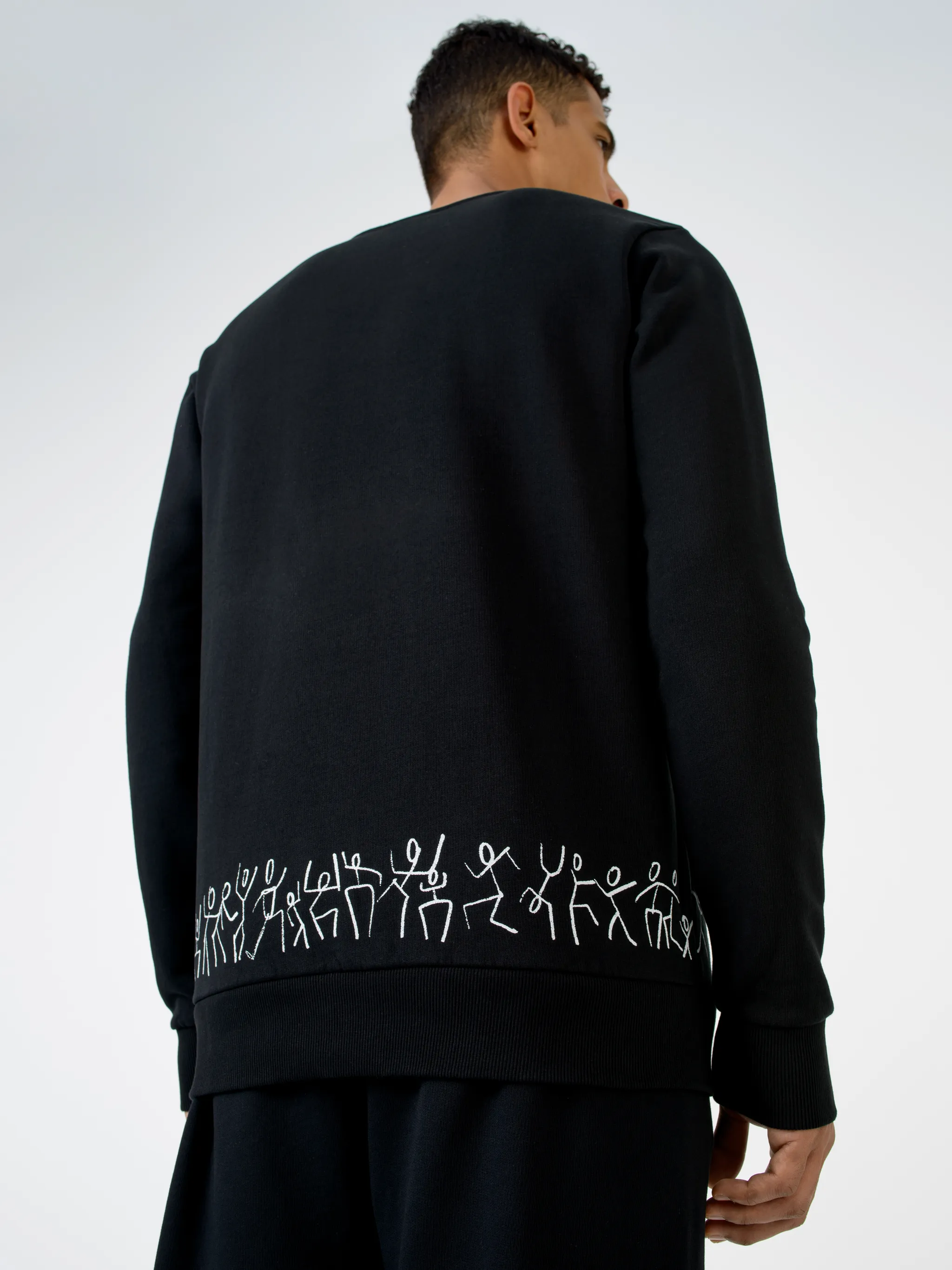 Black cotton Cross Tribe crew-neck sweatshirt from Marcelo Burlon County of Milan featuring embroidered logo at the chest, graphic print, crew neck, long sleeves and straight hem.