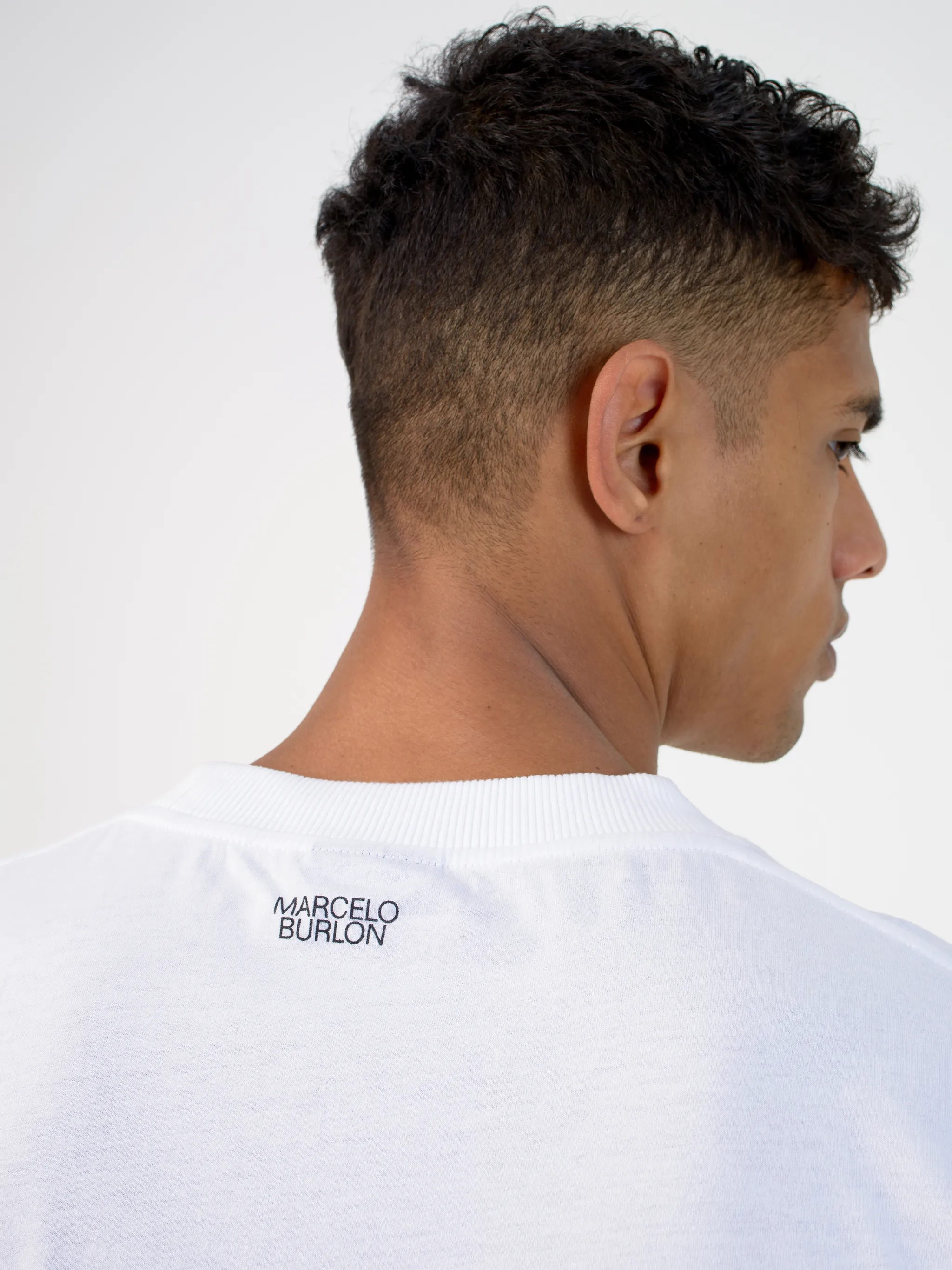 White cotton-blend logo-print T-shirt from MARCELO BURLON COUNTY OF MILAN featuring crew neck and logo print at the chest.