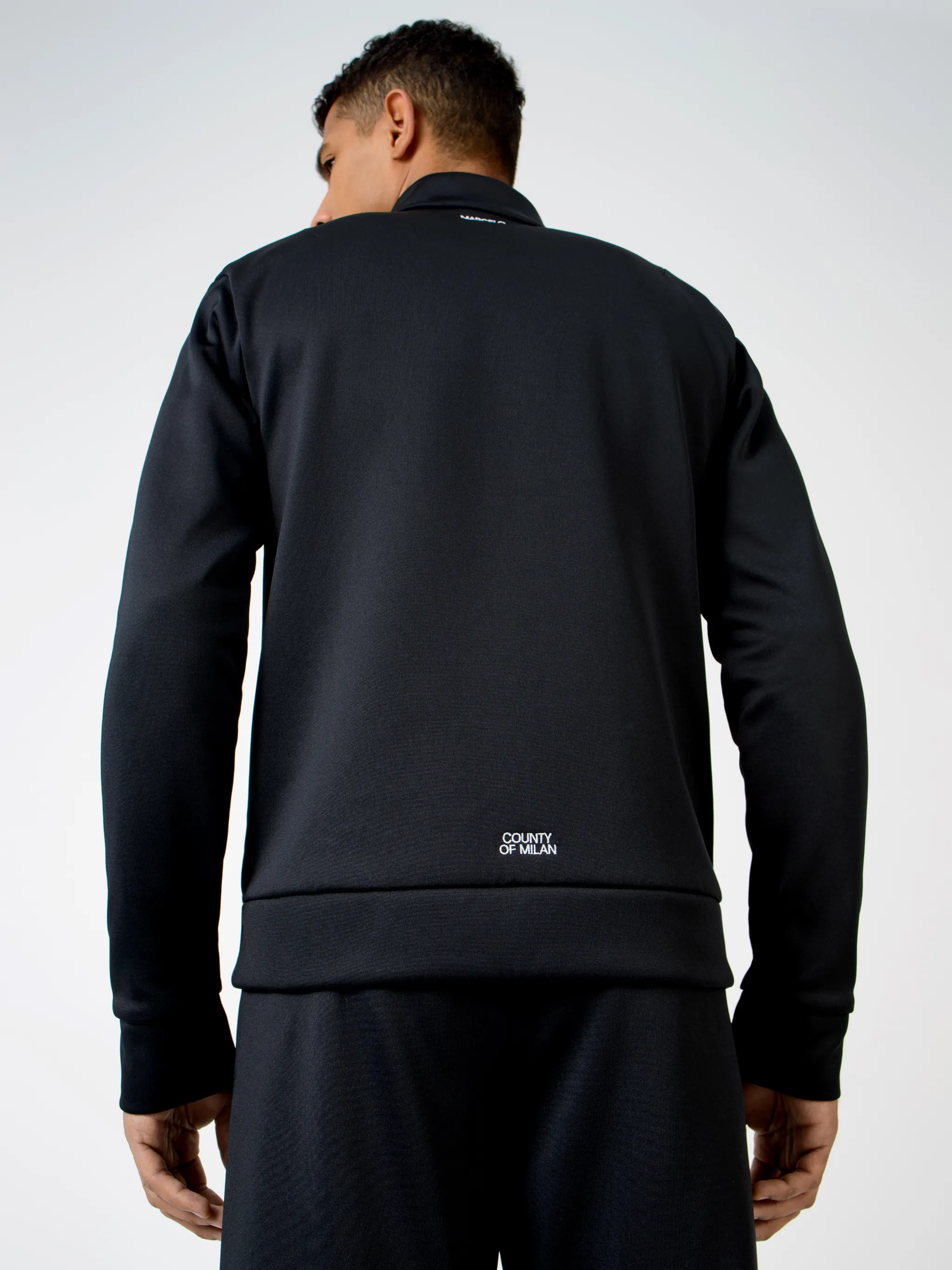 Black cotton-blend logo embroidery zip-up sweatshirt from MARCELO BURLON COUNTY OF MILAN featuring stand-up collar, front zip fastening, embroidered logo, two side slit pockets, long sleeves and loose fit.