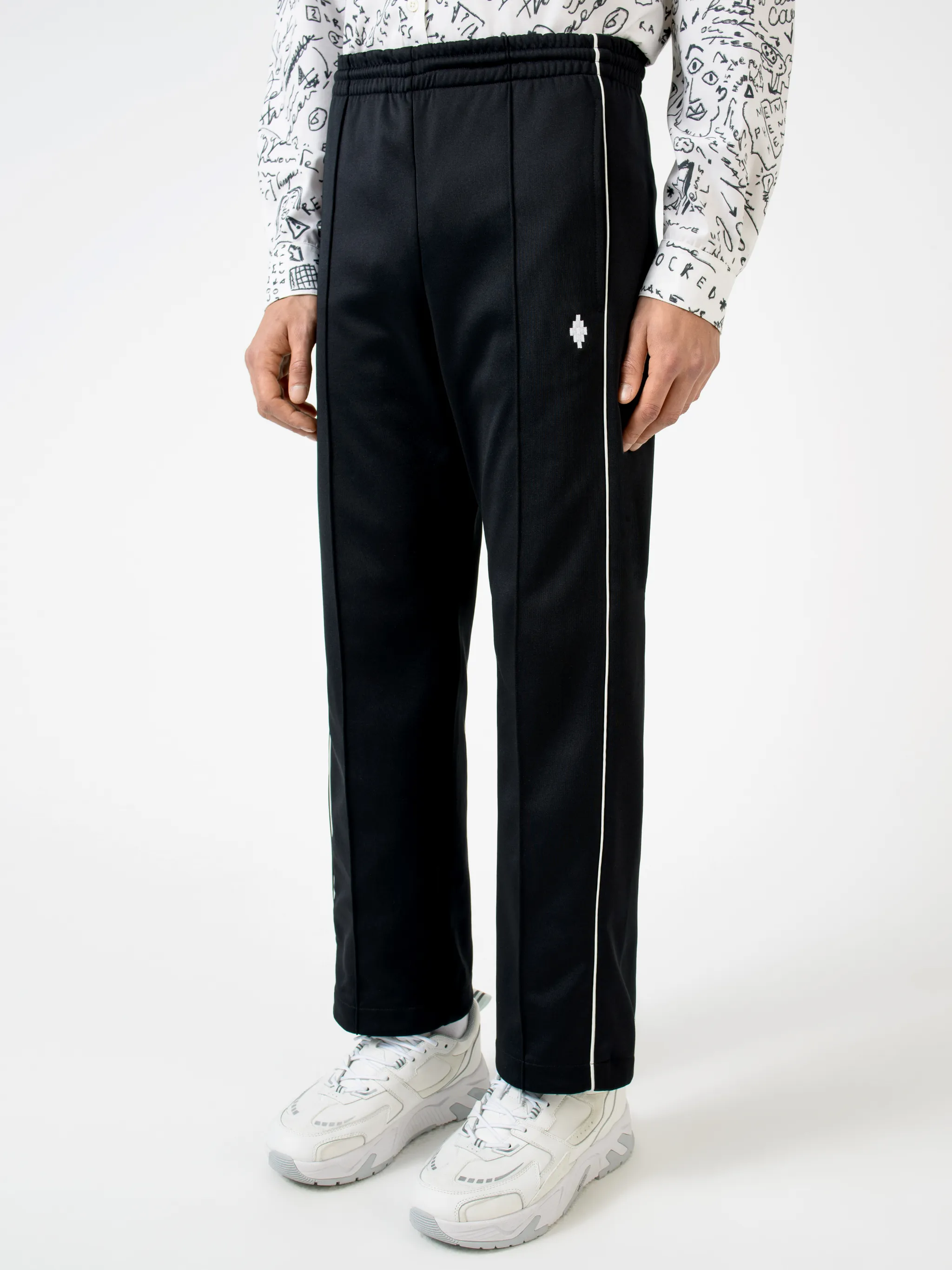 Black cotton-blend logo track pants from MARCELO BURLON COUNTY OF MILAN featuring elasticated waistband, embroidered logo, two side slit pockets, rear welt pocket, side stripe detailing and loose fit.