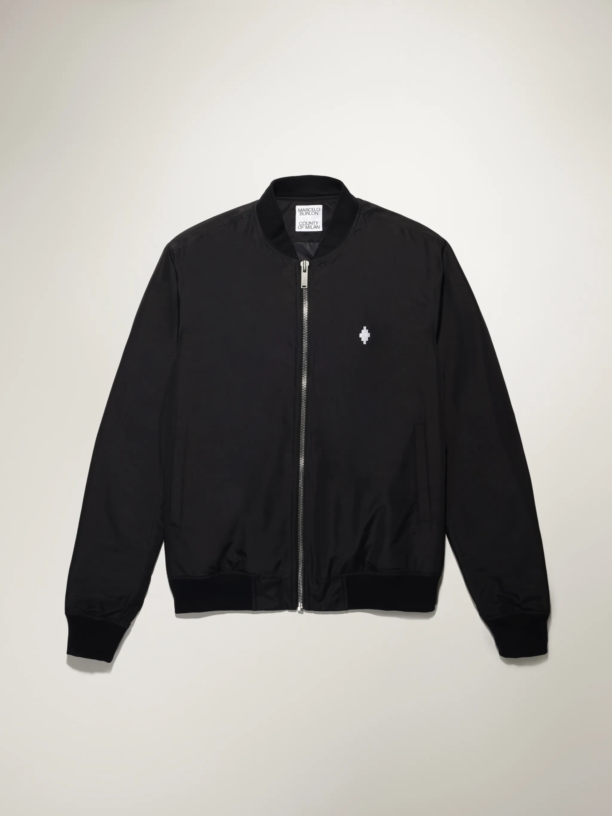 Black cotton-blend embroidered logo bomber jacket from Marcelo Burlon County of Milan featuring embroidered logo at the chest, logo print to the rear, front zip fastening, long sleeves and elasticated hem.