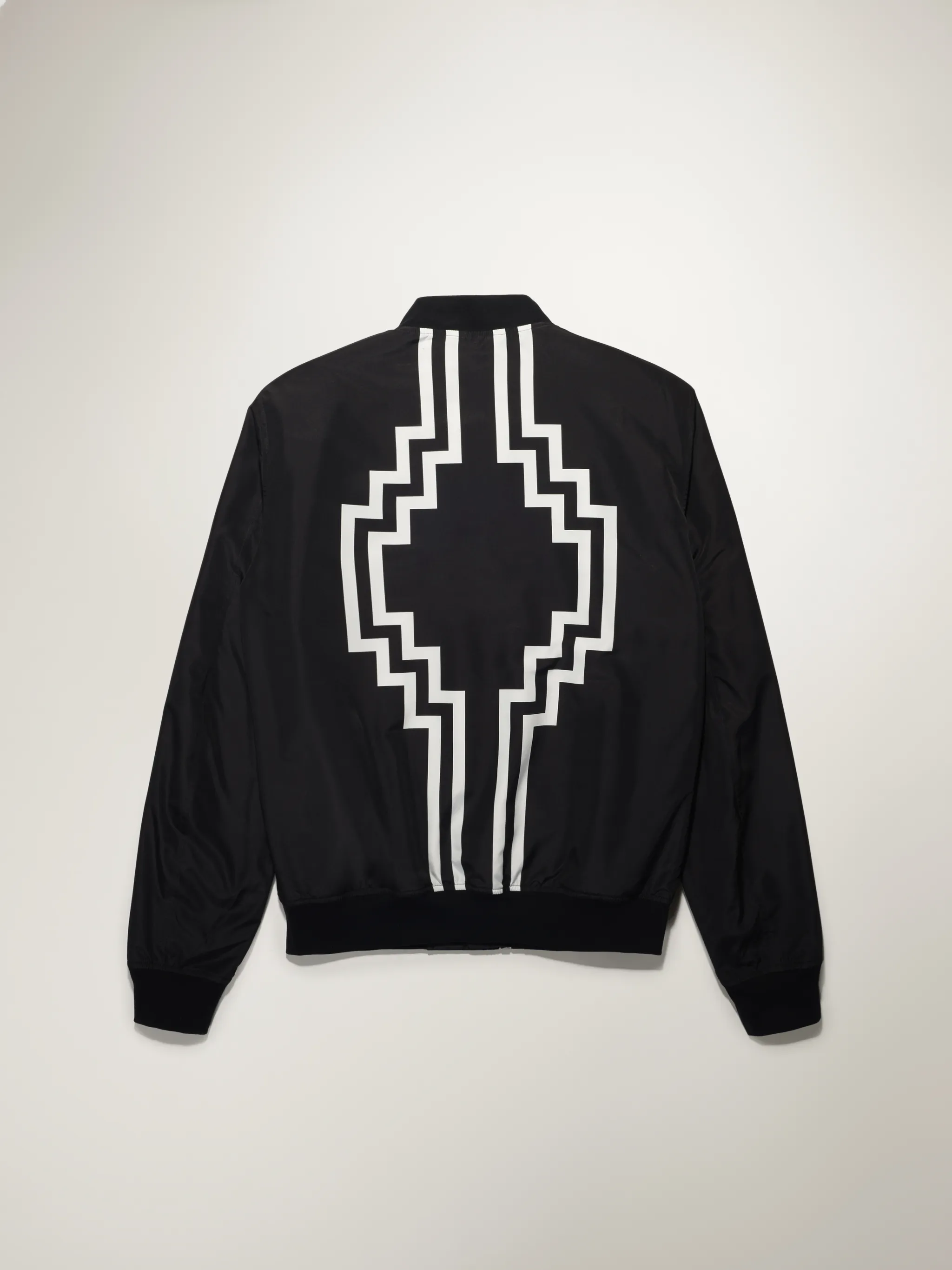 Black cotton-blend embroidered logo bomber jacket from Marcelo Burlon County of Milan featuring embroidered logo at the chest, logo print to the rear, front zip fastening, long sleeves and elasticated hem.