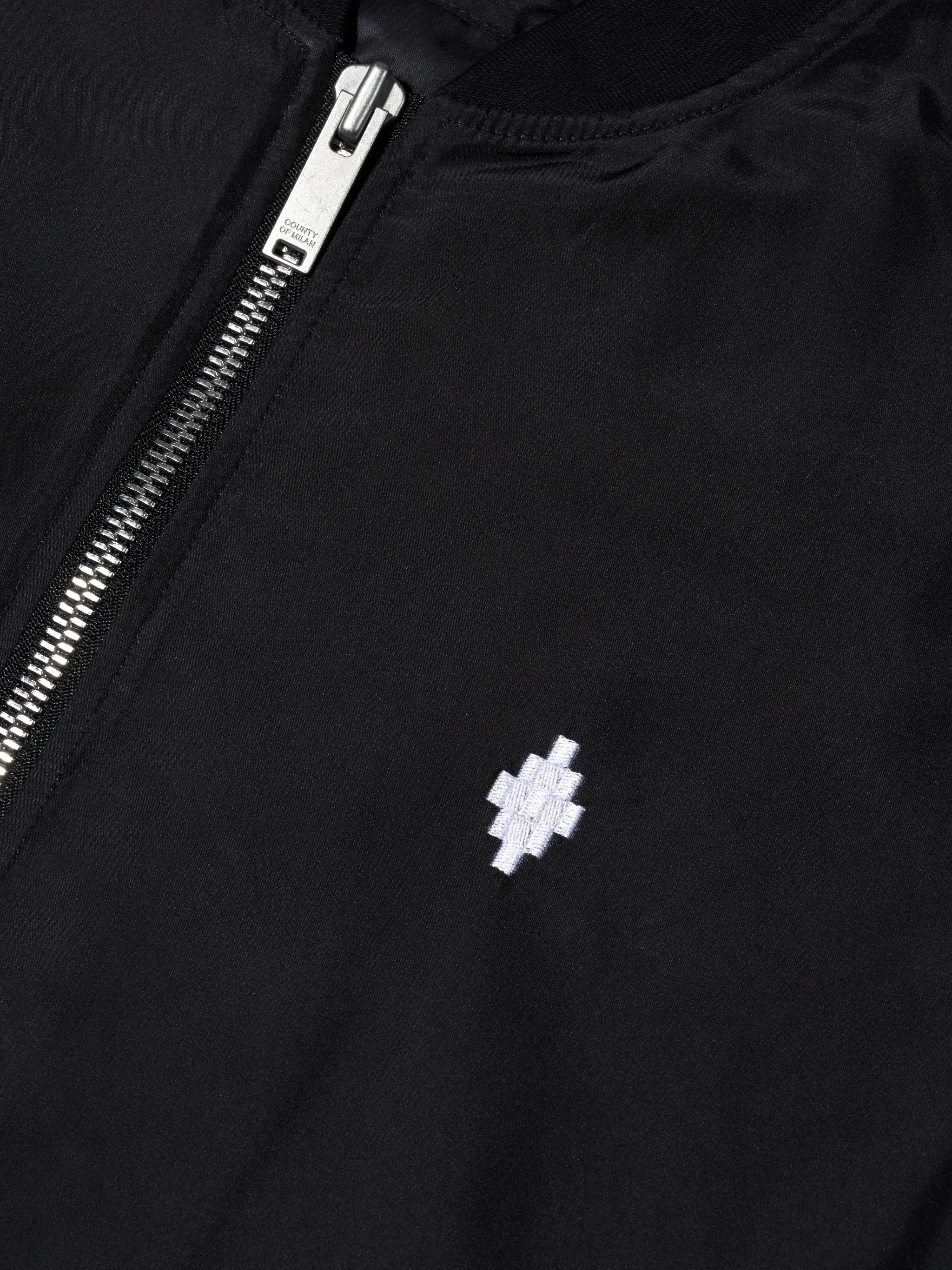 Black cotton-blend embroidered logo bomber jacket from Marcelo Burlon County of Milan featuring embroidered logo at the chest, logo print to the rear, front zip fastening, long sleeves and elasticated hem.