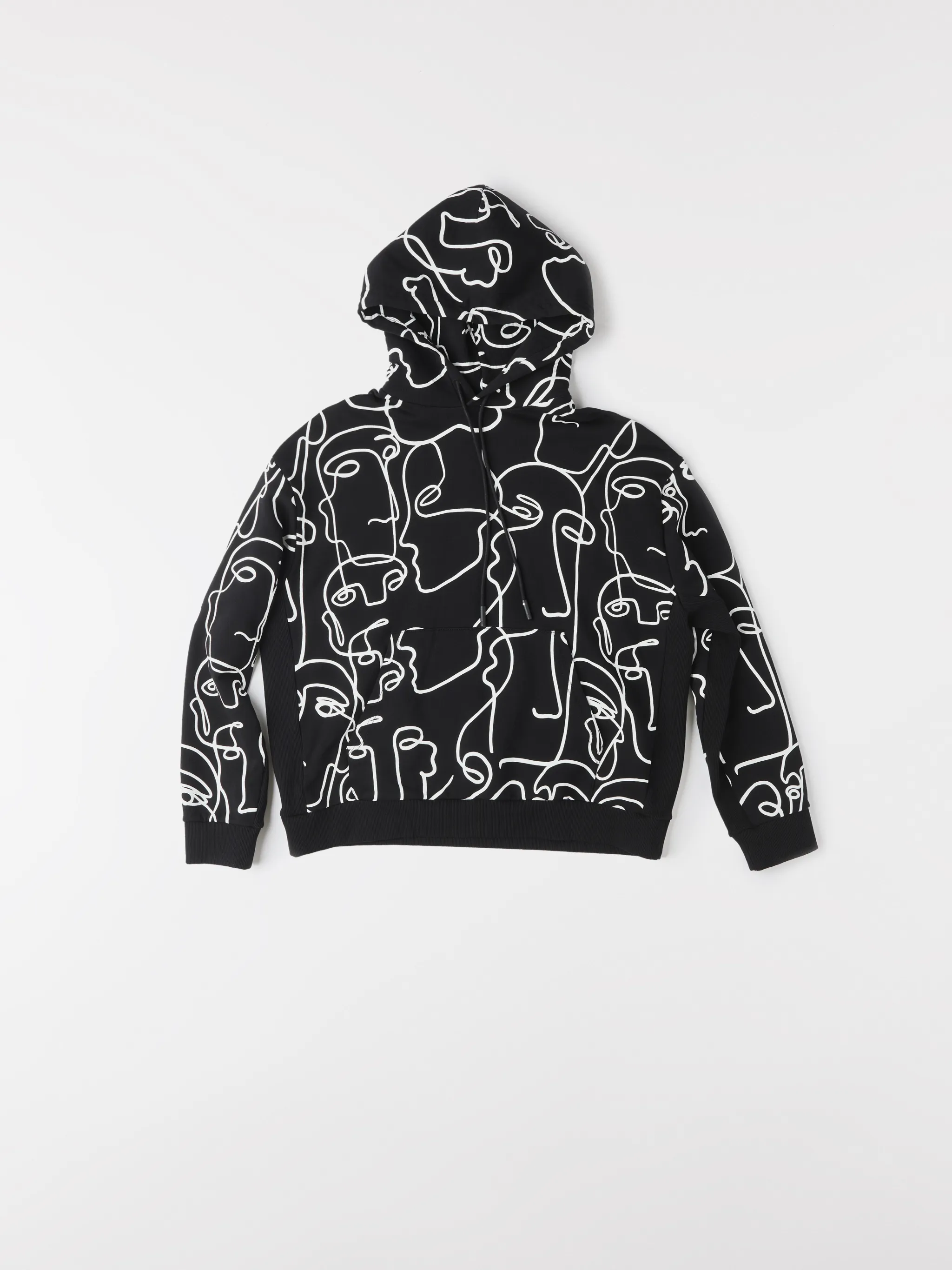 Black/white cotton all-over Faces print hoodie from Marcelo Burlon County of Milan featuring all-over logo print, drawstring hood, two front pouch pockets, long sleeves and straight hem.