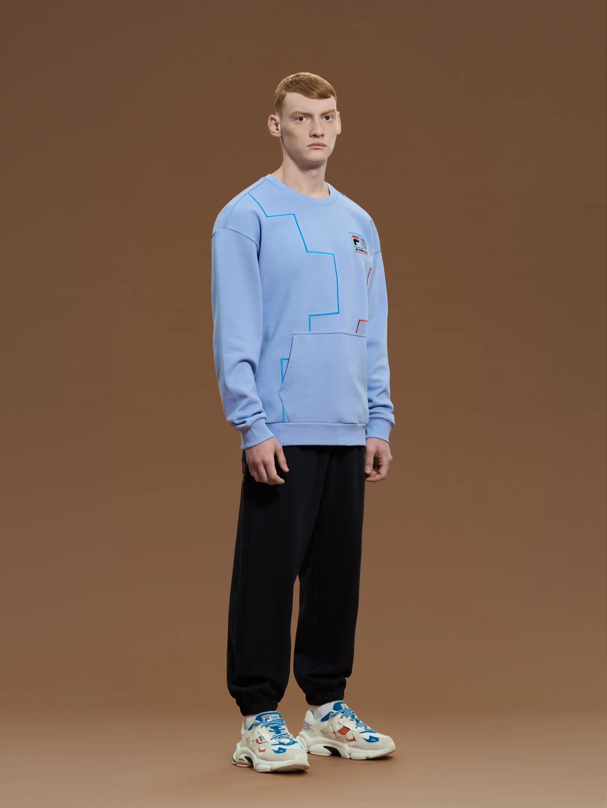 Lilac cotton x FILA logo patch sweatshirt from Marcelo Burlon County of Milan featuring logo patch to the front, front pouch pocket, crew neck, long sleeves and straight hem.
