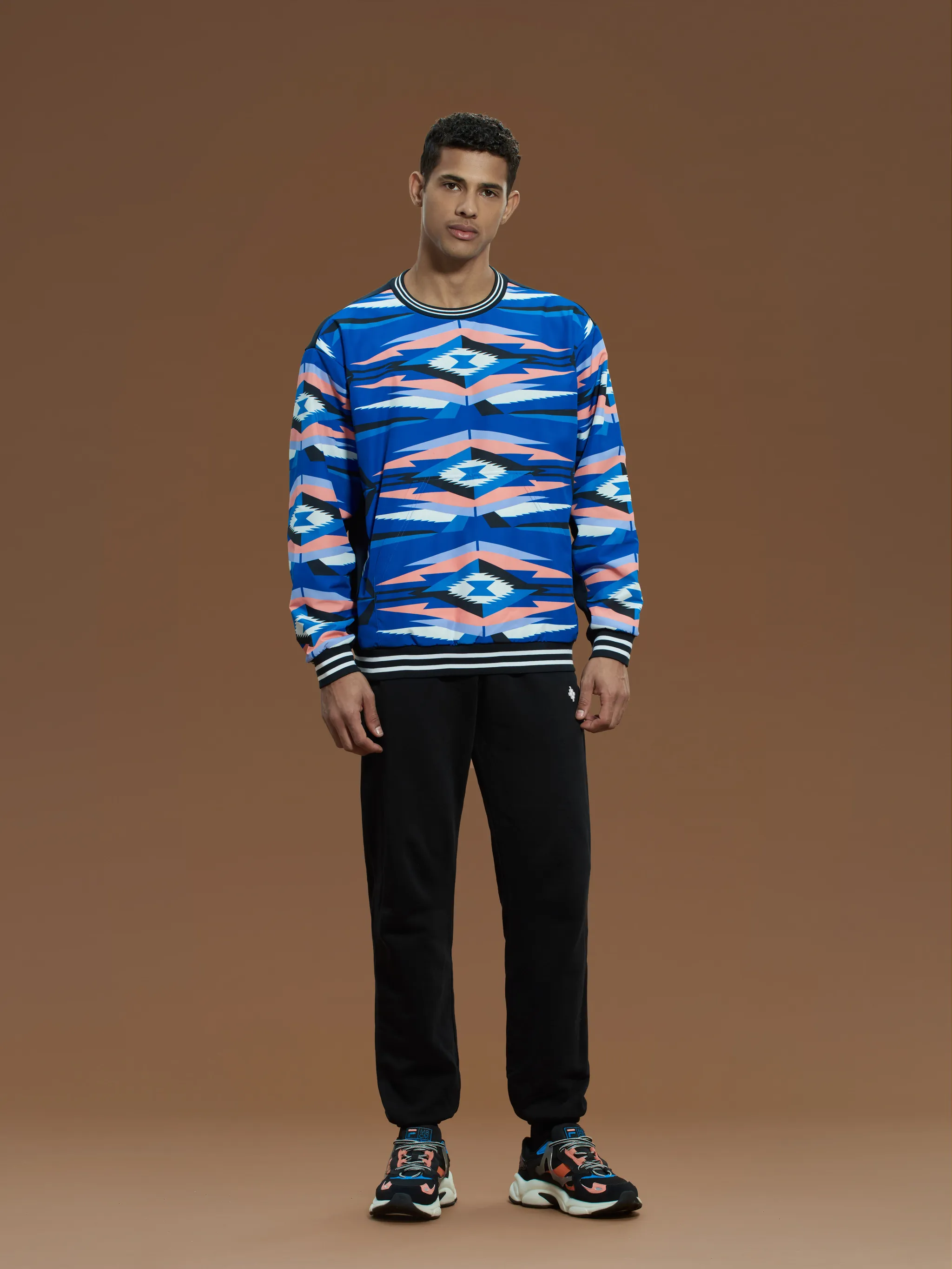 Blue/pink/black cotton x FILA geometric-print sweatshirt from Marcelo Burlon County of Milan featuring geometric-pattern print, stripe trim, logo patch to the rear, crew neck, drop shoulder, long sleeves and straight hem.