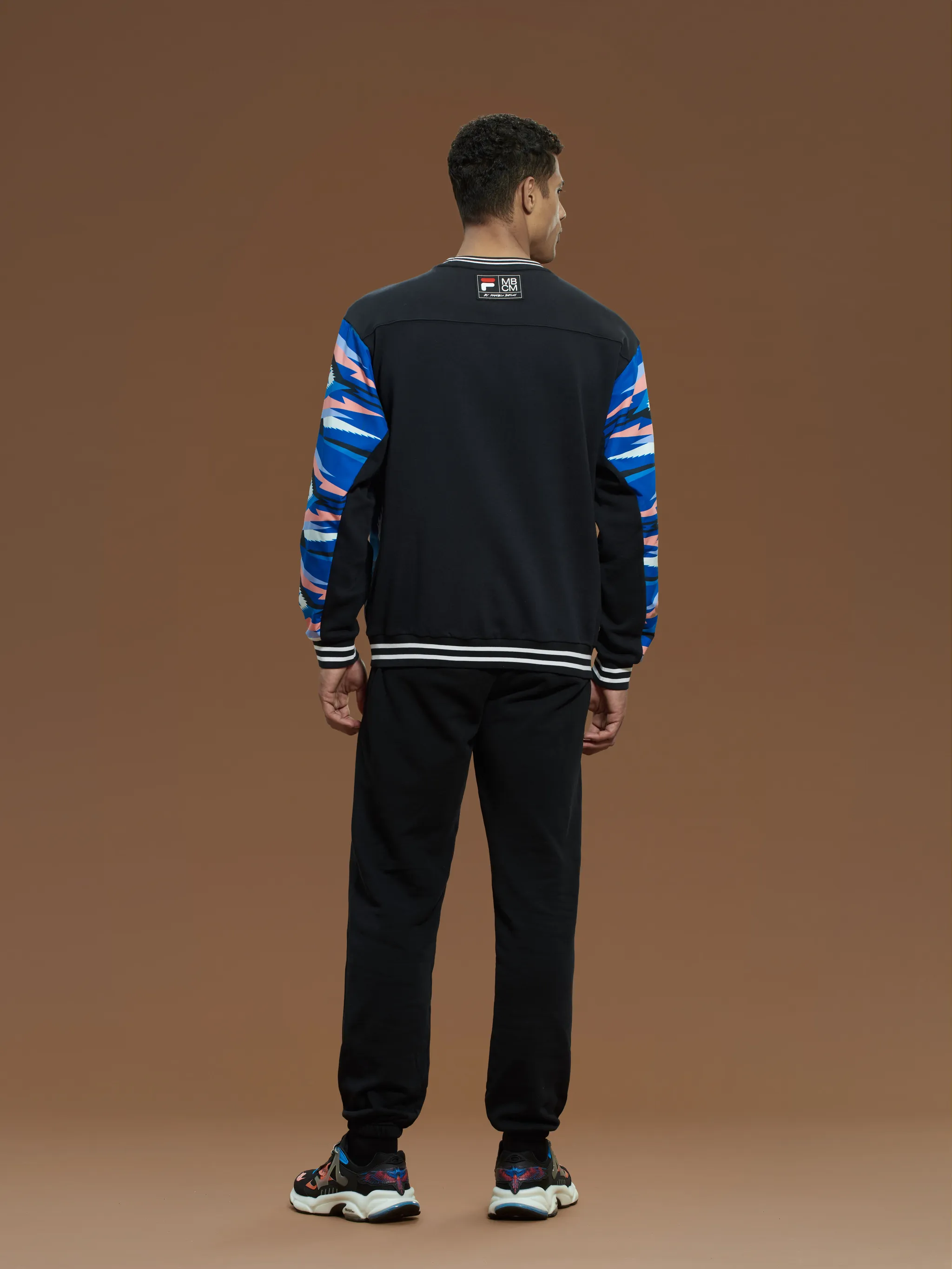 Blue/pink/black cotton x FILA geometric-print sweatshirt from Marcelo Burlon County of Milan featuring geometric-pattern print, stripe trim, logo patch to the rear, crew neck, drop shoulder, long sleeves and straight hem.
