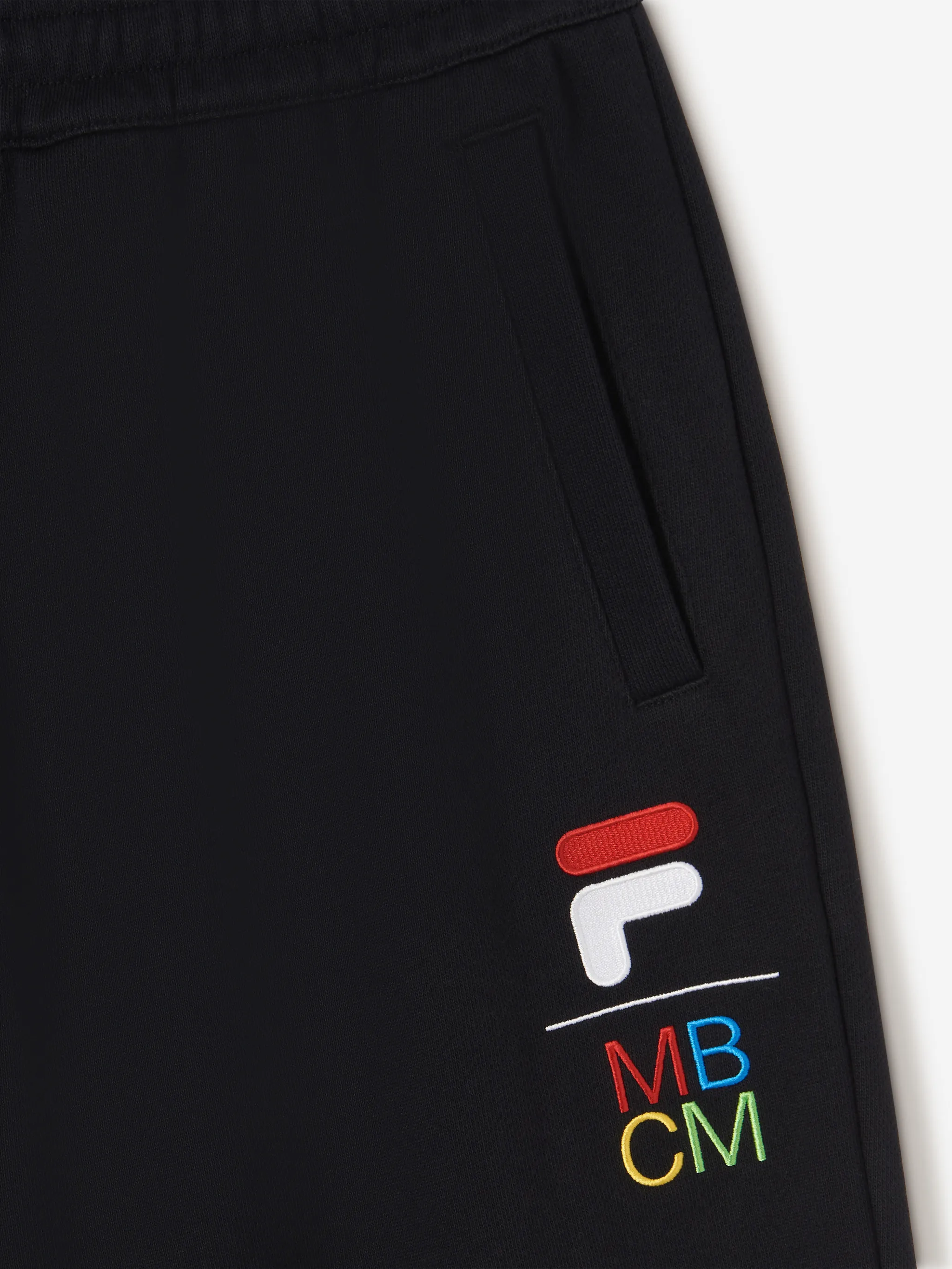 Black cotton x Fila logo-embroidered track pants from Marcelo Burlon County of Milan featuring embroidered logo to the front, tapered leg, elasticated drawstring waistband, two side slit pockets, rear patch pocket and elasticated ankles.