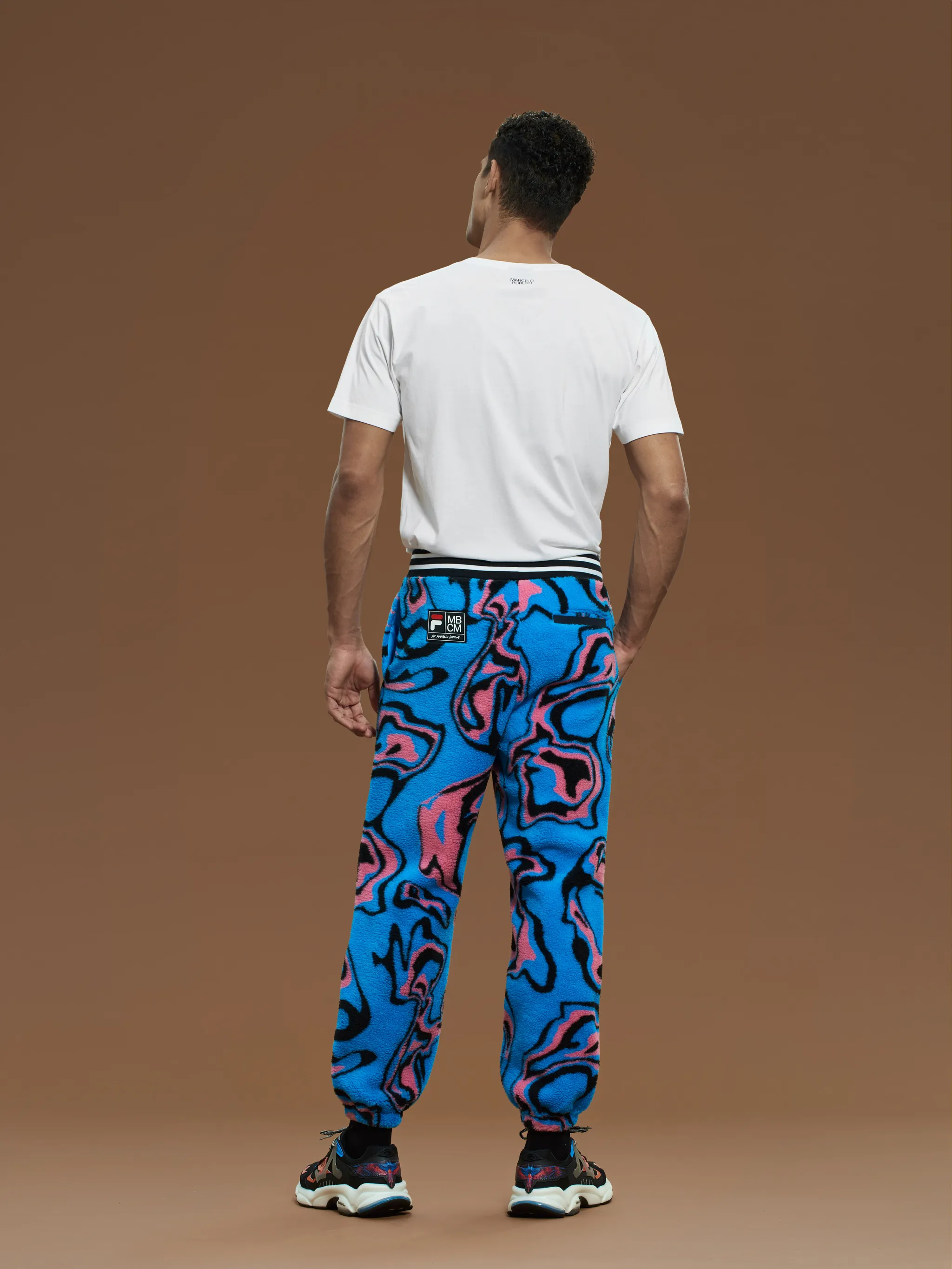 Multicolour geometric print trousers from Marcelo Burlon County of Milan featuring geometric-pattern print, wide leg, elasticated drawstring waistband and elasticated ankles.