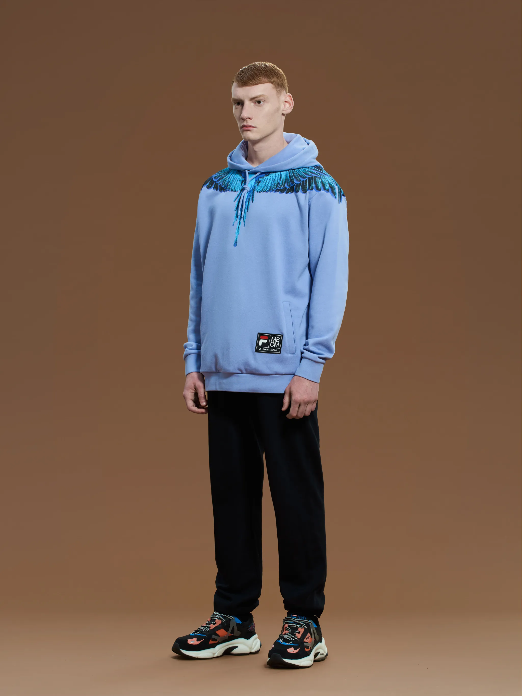 Blue/lilac cotton feather print hoodie from Marcelo Burlon County of Milan featuring feather print, logo patch to the front, drawstring hood, slip pockets to the sides, long sleeves and straight hem.