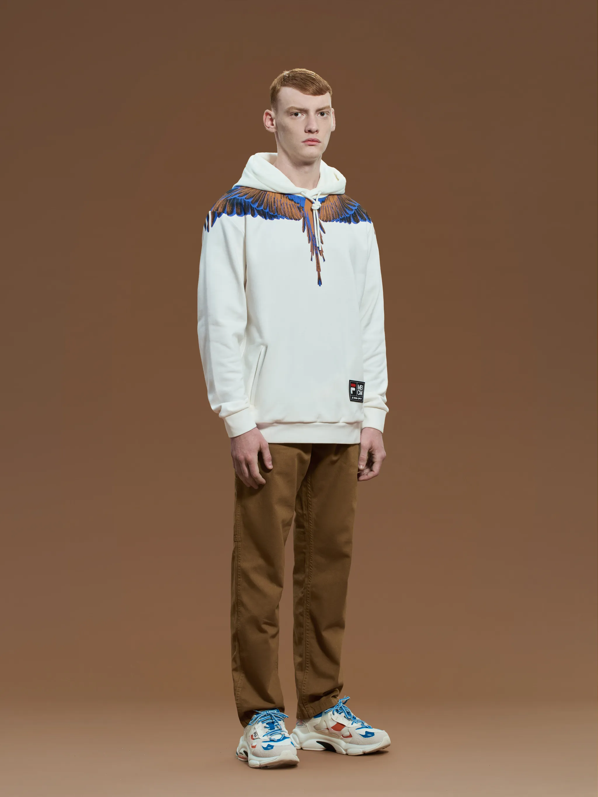 White/multicolour cotton x FILA feather print hoodie from Marcelo Burlon County of Milan featuring feather print, logo patch to the front, drawstring hood, slip pockets to the sides, long sleeves and straight hem.