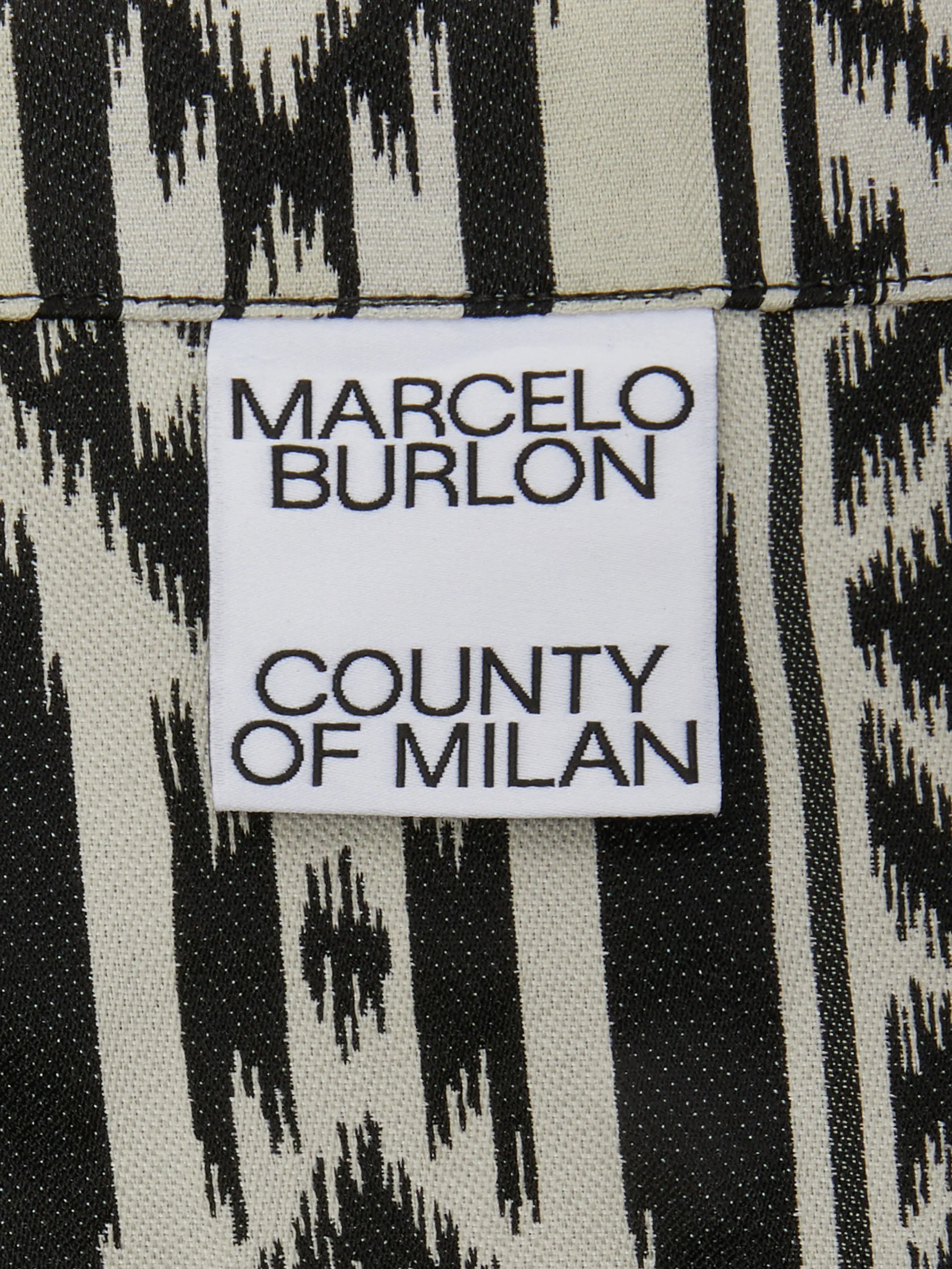 Black/white Folk jacquard-pattern tote bag from Marcelo Burlon County of Milan featuring full jacquard, two top handles, internal logo patch, open top and cord detail.
