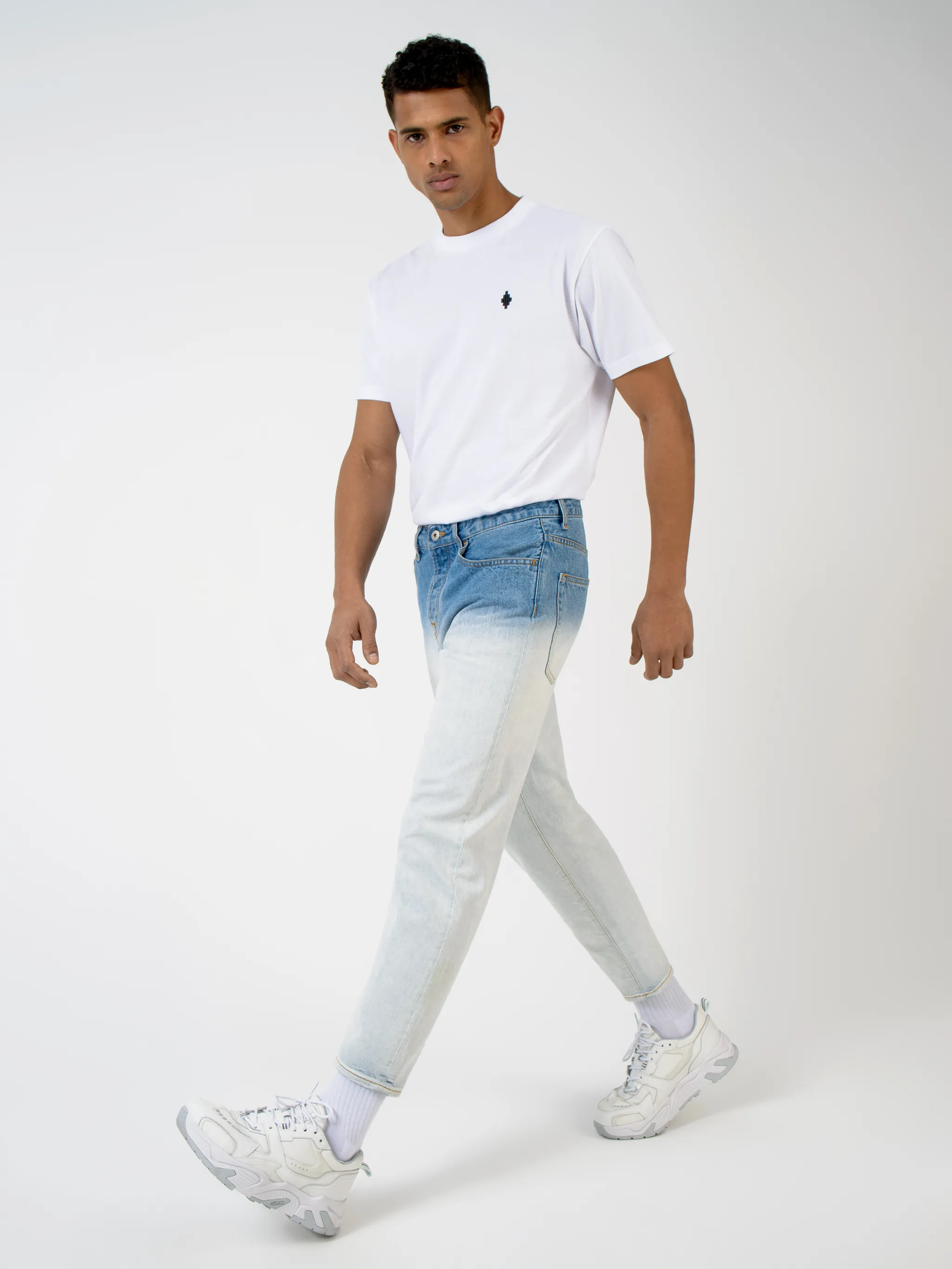 Blue cotton-blend gradient-effect straight-leg jeans from Marcelo Burlon County of Milan featuring gradient effect, logo patch to the rear, belt loops, mid-rise, front button and zip fastening, straight leg and classic five pockets.