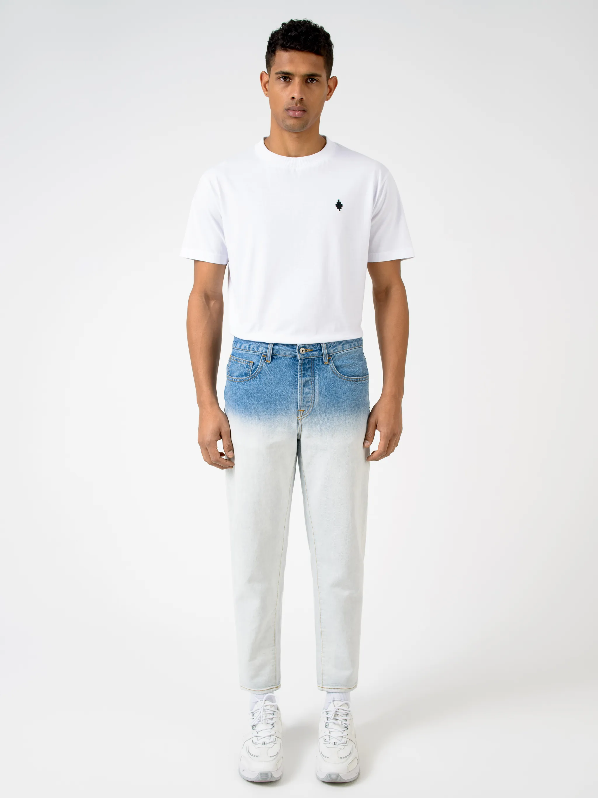 Blue cotton-blend gradient-effect straight-leg jeans from Marcelo Burlon County of Milan featuring gradient effect, logo patch to the rear, belt loops, mid-rise, front button and zip fastening, straight leg and classic five pockets.