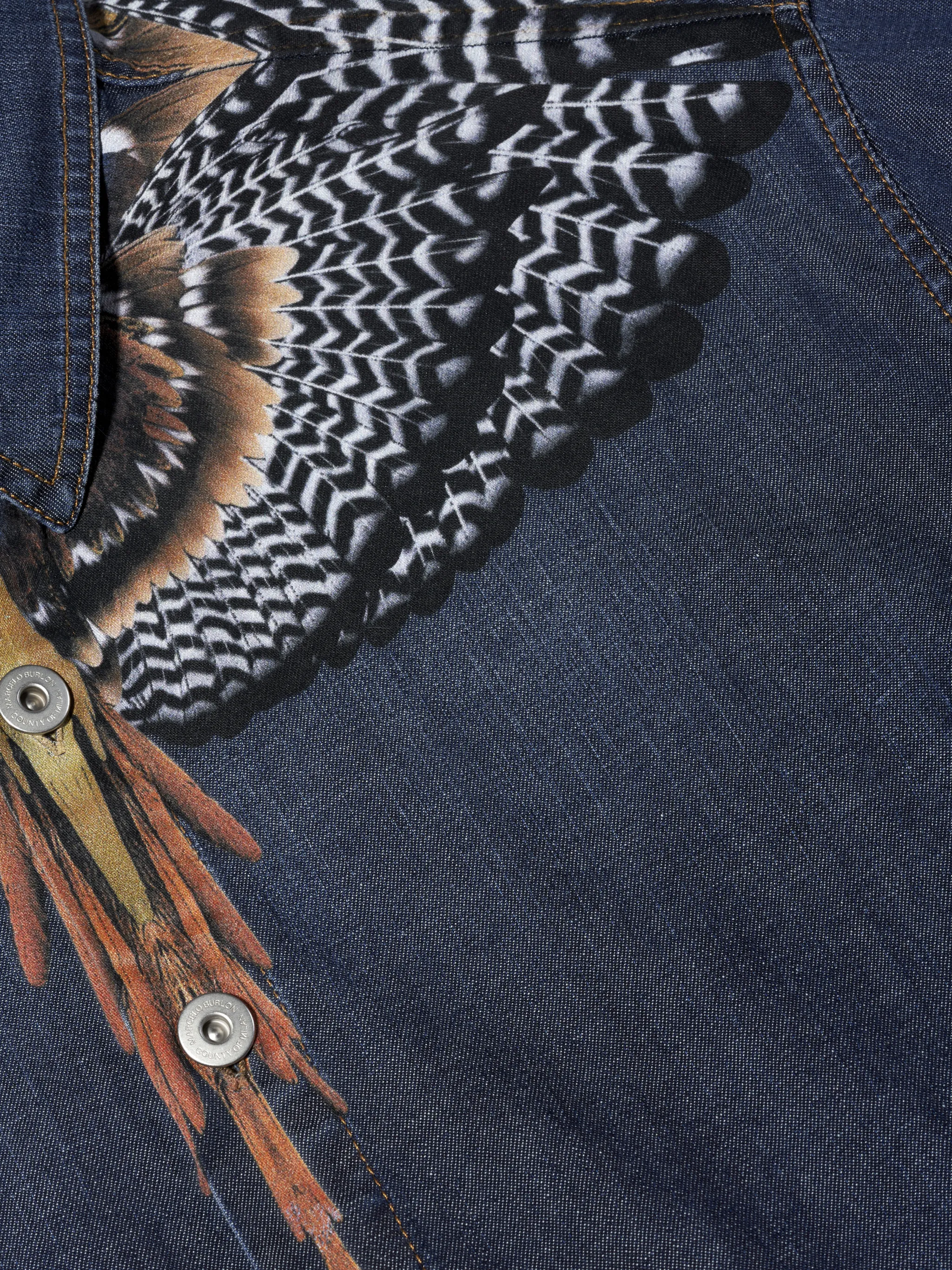 Blue/multicolour cotton-denim Wings-print denim shirt from Marcelo Burlon County of Milan featuring classic collar, wings print, front button fastening, long sleeves, buttoned cuffs and curved hem.