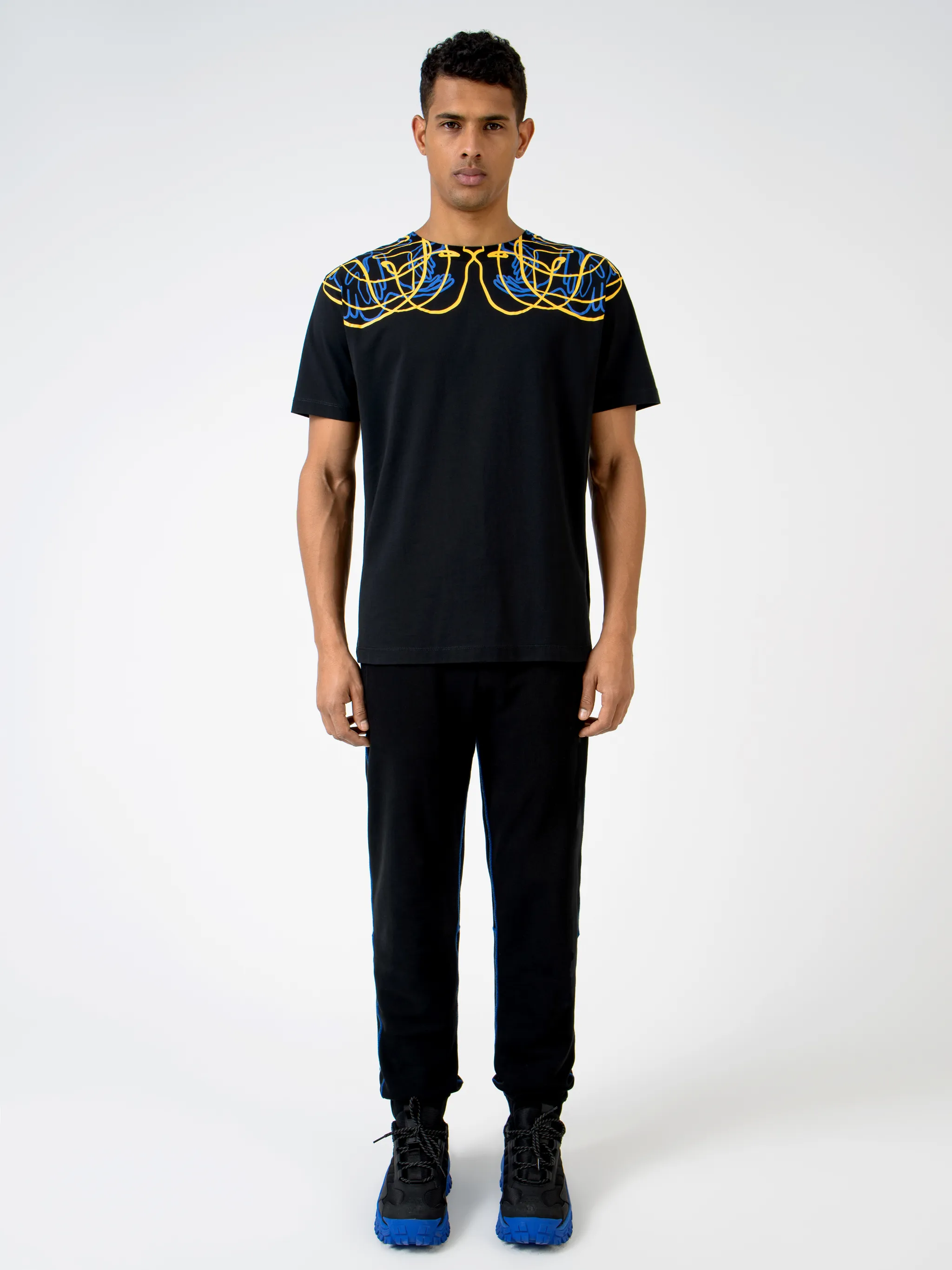 Black cotton printed T-shirt from MARCELO BURLON COUNTY OF MILAN featuring round neck, short sleeves, straight hem and abstract pattern print.