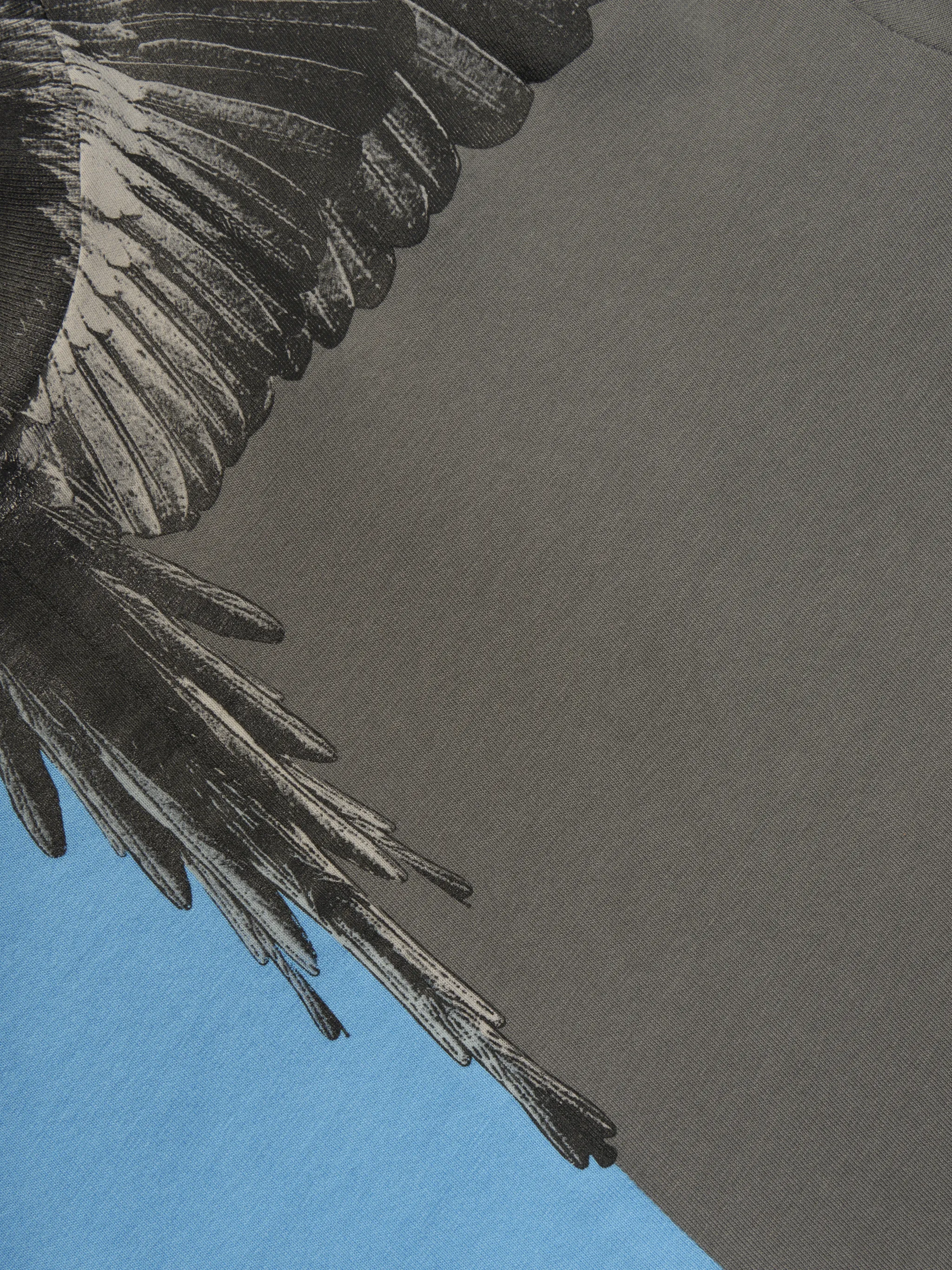 Light blue/grey cotton two-tone Wings print T-shirt from Marcelo Burlon Kids featuring signature Marcelo Burlon Wings print, two-tone design, short sleeves, round neck and straight hem.