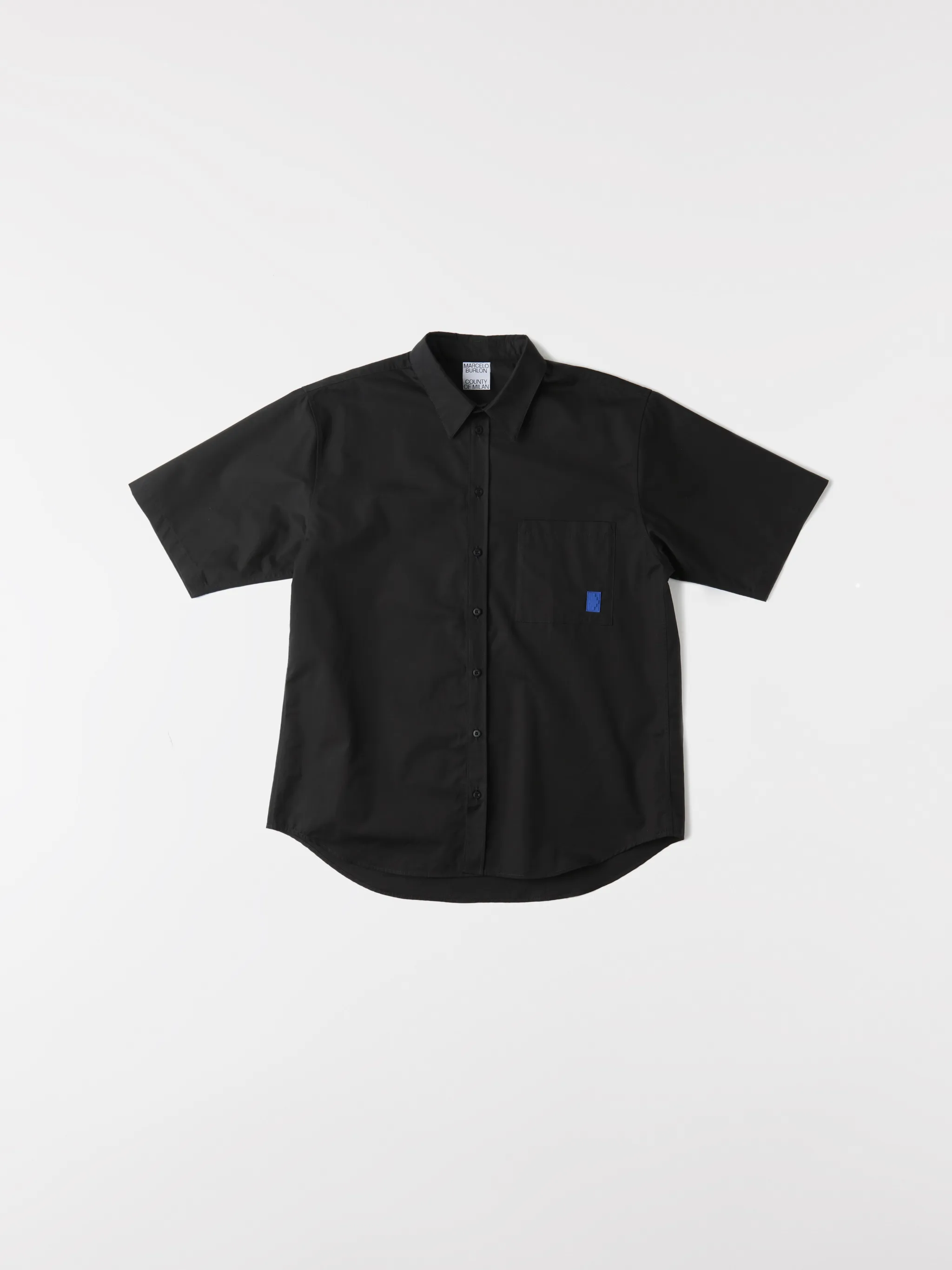 Black cotton logo-print short-sleeve shirt from Marcelo Burlon County of Milan featuring logo print to the rear, logo patches to the front, classic collar, front button fastening, short sleeves, chest patch pocket and curved hem.