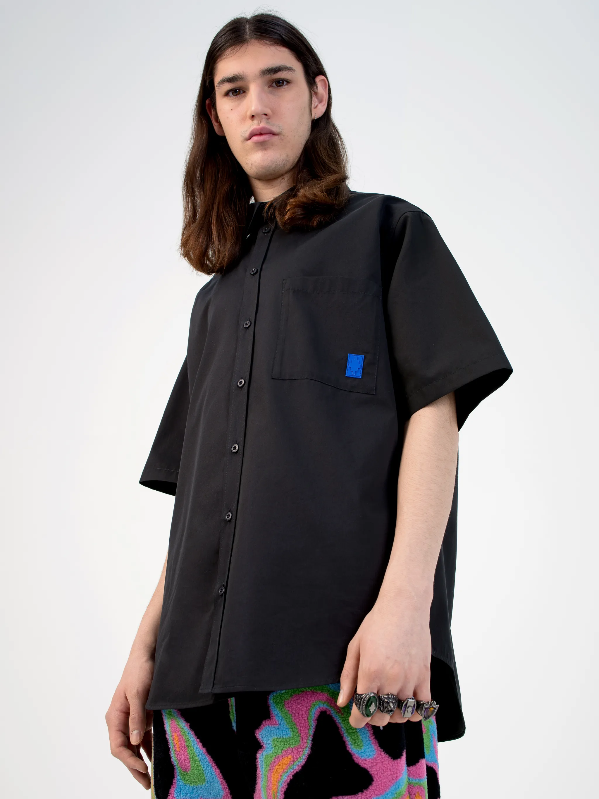 Black cotton logo-print short-sleeve shirt from Marcelo Burlon County of Milan featuring logo print to the rear, logo patches to the front, classic collar, front button fastening, short sleeves, chest patch pocket and curved hem.