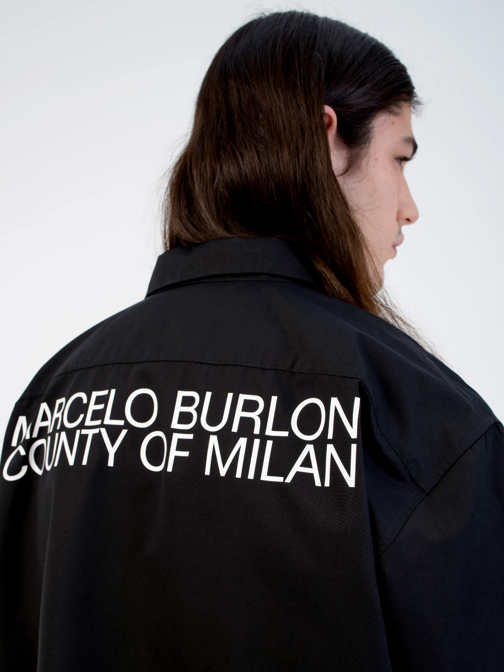 Black cotton logo-print short-sleeve shirt from Marcelo Burlon County of Milan featuring logo print to the rear, logo patches to the front, classic collar, front button fastening, short sleeves, chest patch pocket and curved hem.