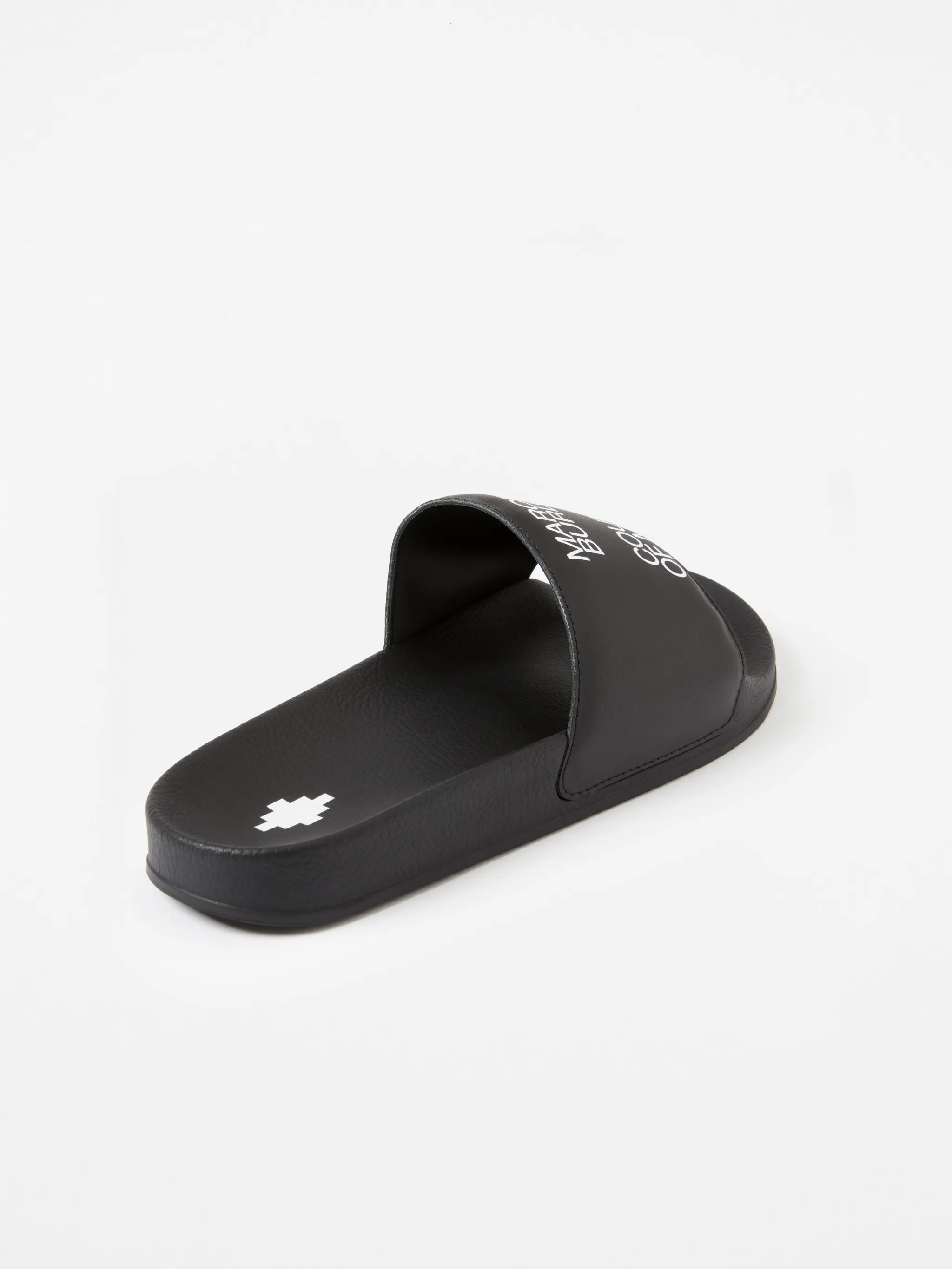 Black/white leather logo sliders from Marcelo Burlon County of Milan featuring slip-on style and all-over logo print.