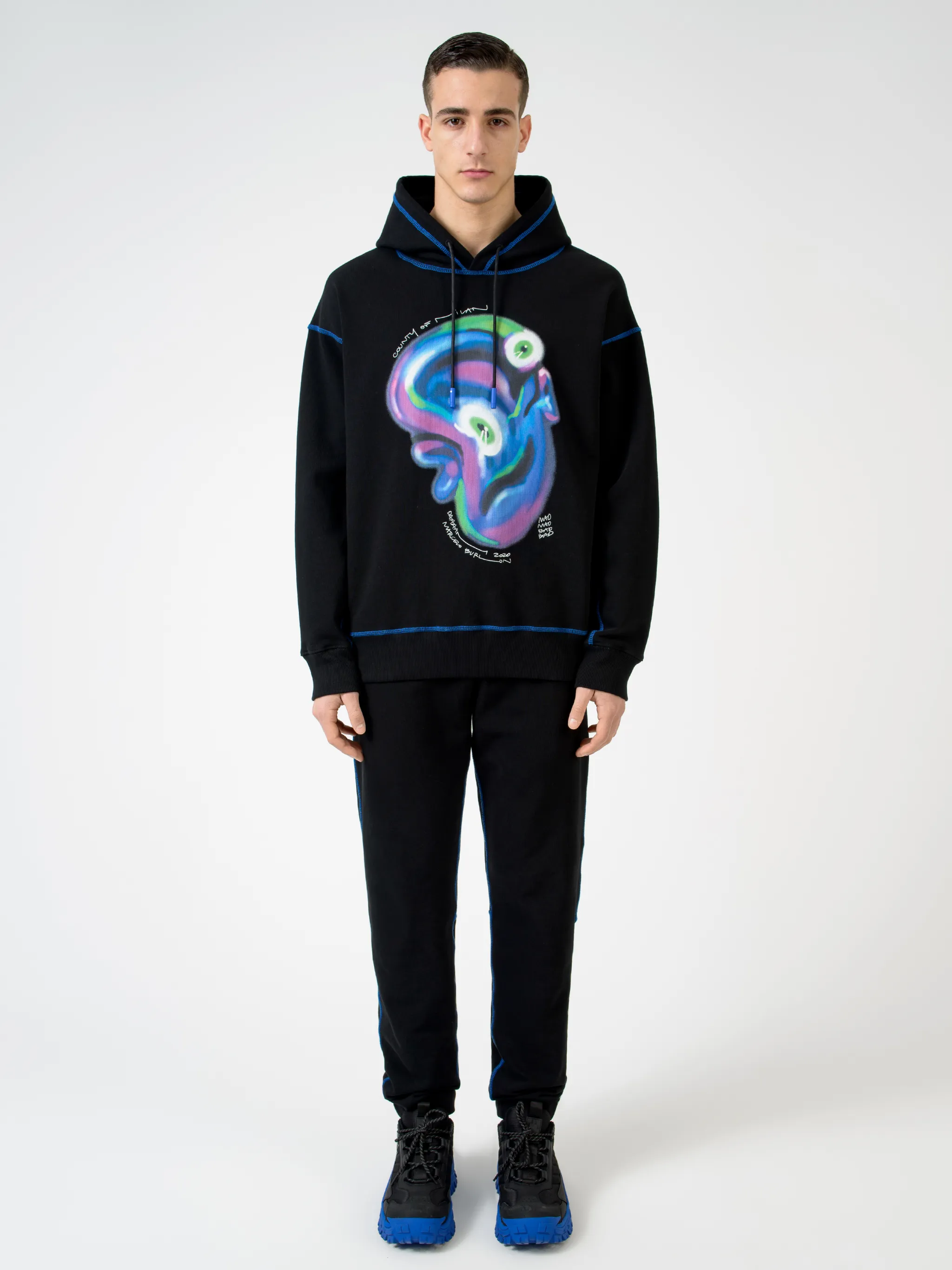 Black Mad Face cotton hoodie from Marcelo Burlon County of Milan featuring graphic print, logo print to the rear, contrasting trim, drawstring hood, long sleeves and straight hem.