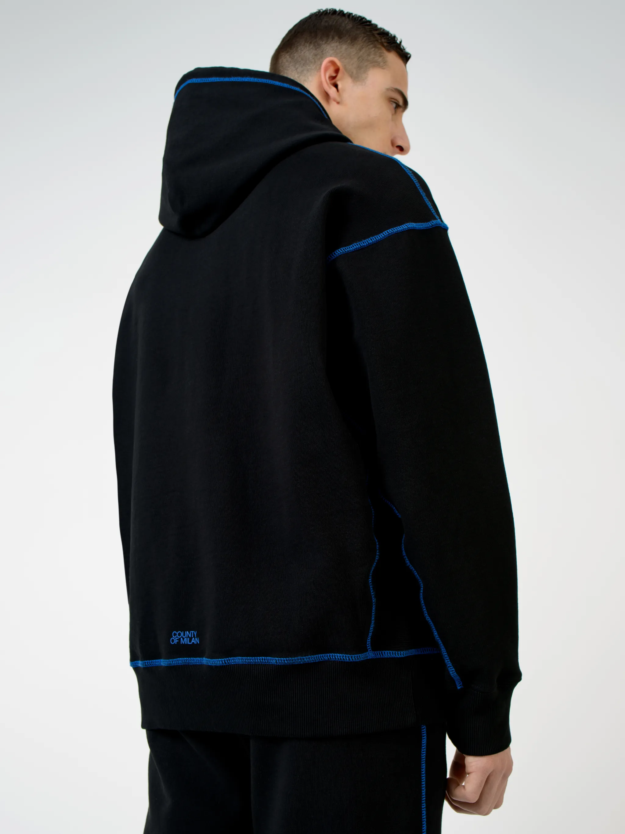 Black Mad Face cotton hoodie from Marcelo Burlon County of Milan featuring graphic print, logo print to the rear, contrasting trim, drawstring hood, long sleeves and straight hem.